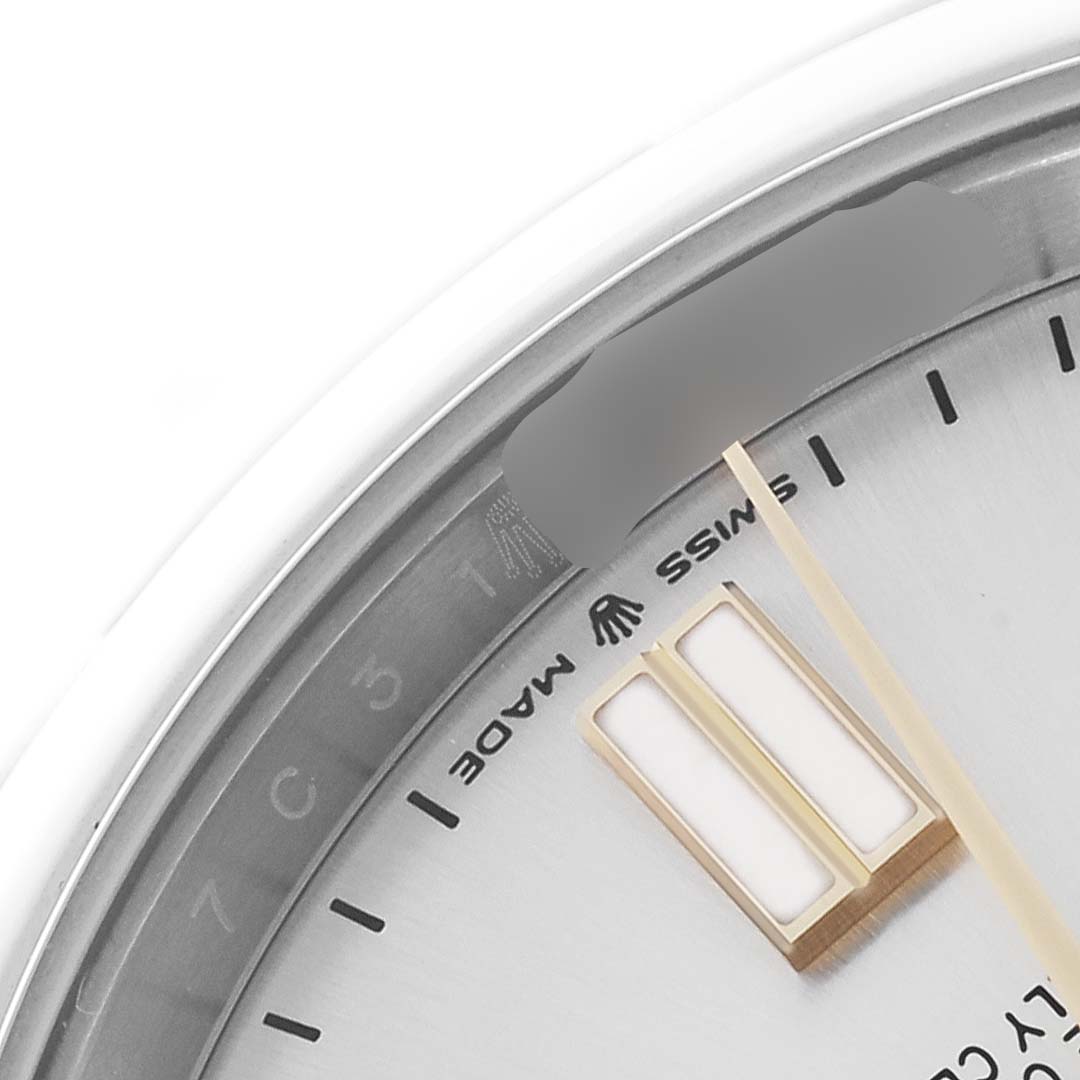 The image shows a close-up of the dial and part of the bezel of a Rolex Oyster Perpetual 124300 Men's Stainless Steel Silver Dial 124300 Men's Stainless Steel Silver Dial watch.