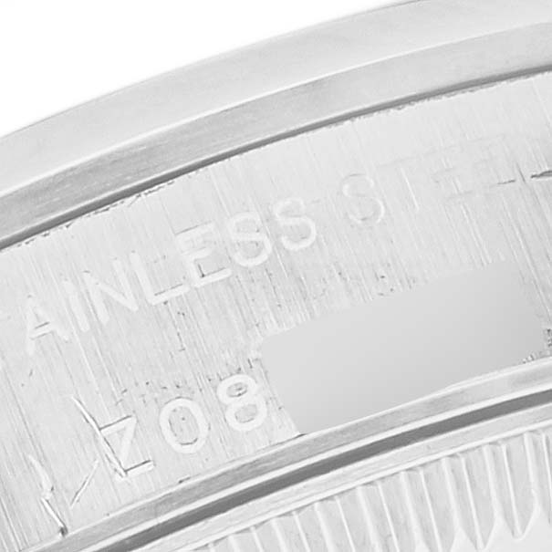 The image shows a close-up of the Rolex Oyster Perpetual 76080 Women
s Stainless Steel Pink Dial 76080 Women
s Stainless Steel Pink Dial watch
s stainless steel case engraving.