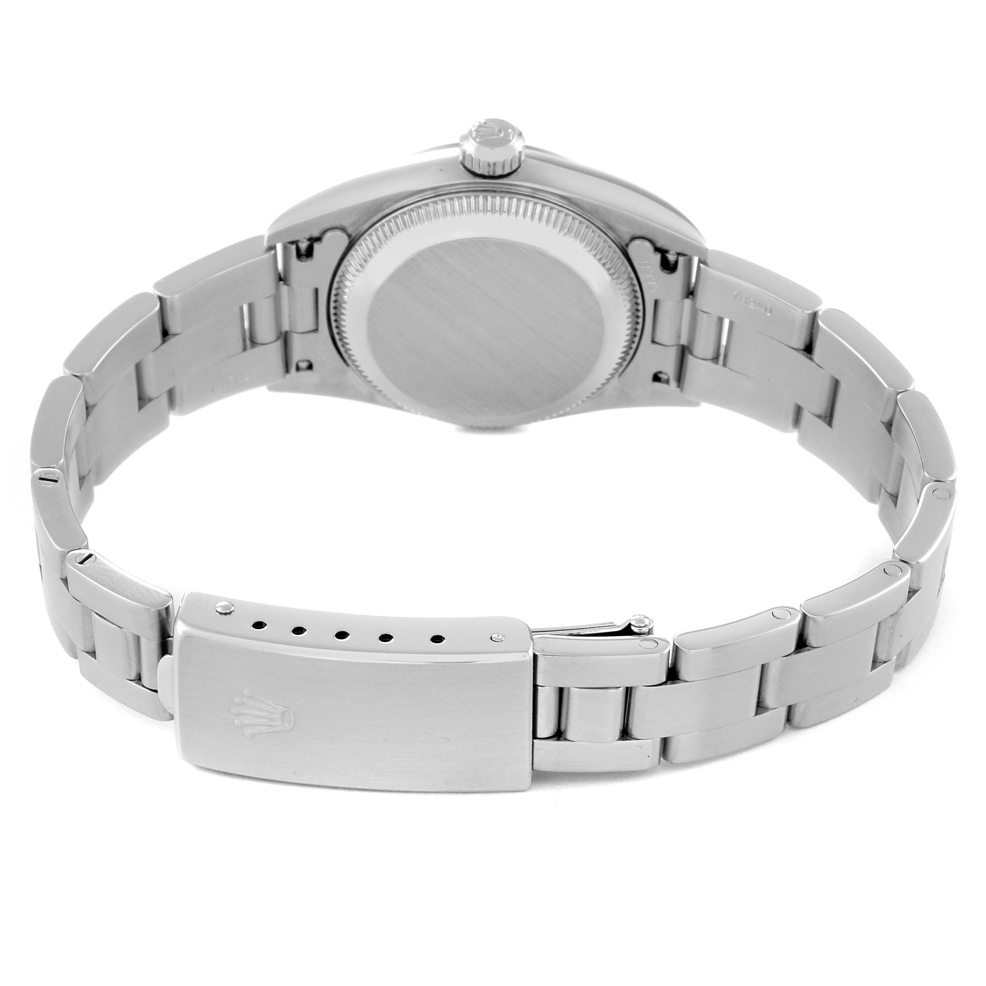 This image shows the back of the Rolex Oyster Perpetual 76080 Women
s Stainless Steel Pink Dial 76080 Women
s Stainless Steel Pink Dial watch, including the bracelet, clasp, and case back.