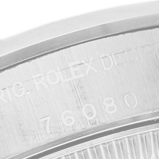 This is a close-up angle showing the engraved text on the side of the Rolex Oyster Perpetual 76080 Women
s Stainless Steel Pink Dial 76080 Women
s Stainless Steel Pink Dial watch case.
