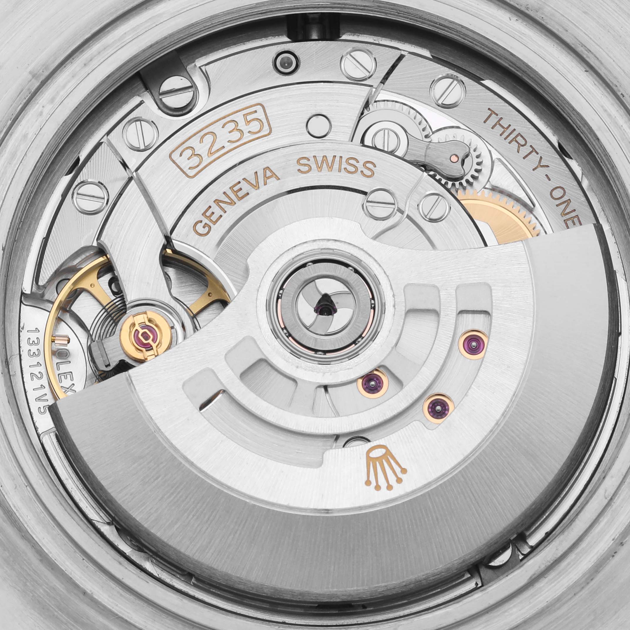 This image shows the movement of the Rolex Sea-Dweller 126600 Men
s Stainless Steel Black Dial 126600 Men
s Stainless Steel Black Dial watch from a top-down angle, highlighting its intricate mechanical parts.