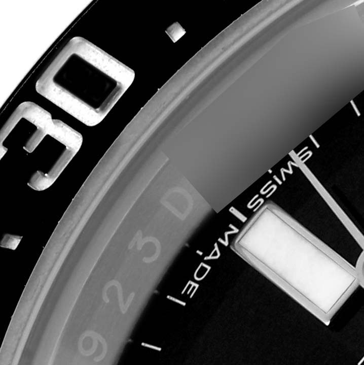 The image shows a close-up of the bezel and part of the dial of the Rolex Sea-Dweller 126600 Men
s Stainless Steel Black Dial 126600 Men
s Stainless Steel Black Dial watch.