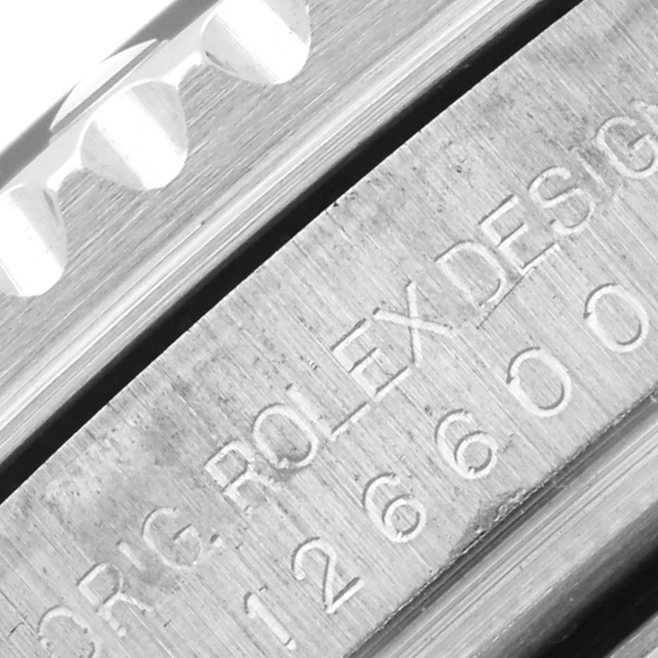 The image shows a close-up of the Rolex Sea-Dweller 126600 Men
s Stainless Steel Black Dial 126600 Men
s Stainless Steel Black Dial
s etched inner bezel with the brand name and model number visible.