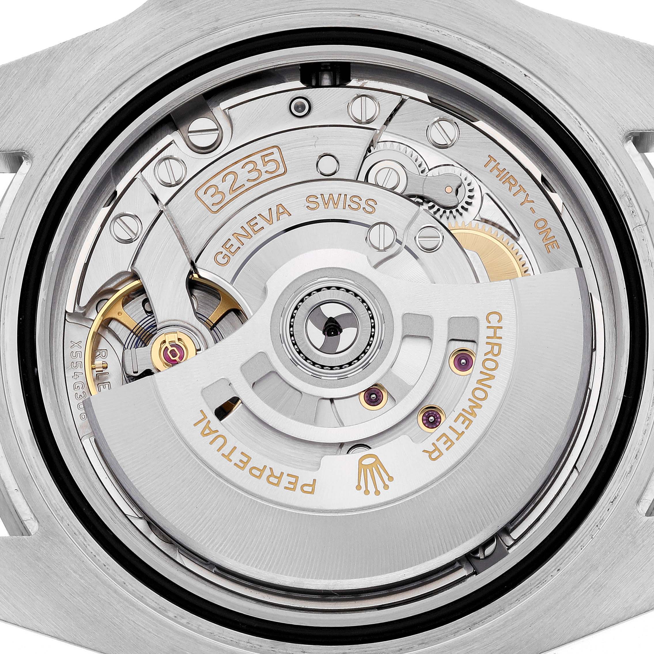 The image shows the intricate movement of a Rolex Submariner 126610LN Men
s Stainless Steel Black Dial 126610LN Men
s Stainless Steel Black Dial, viewed from the back, highlighting its mechanical components.