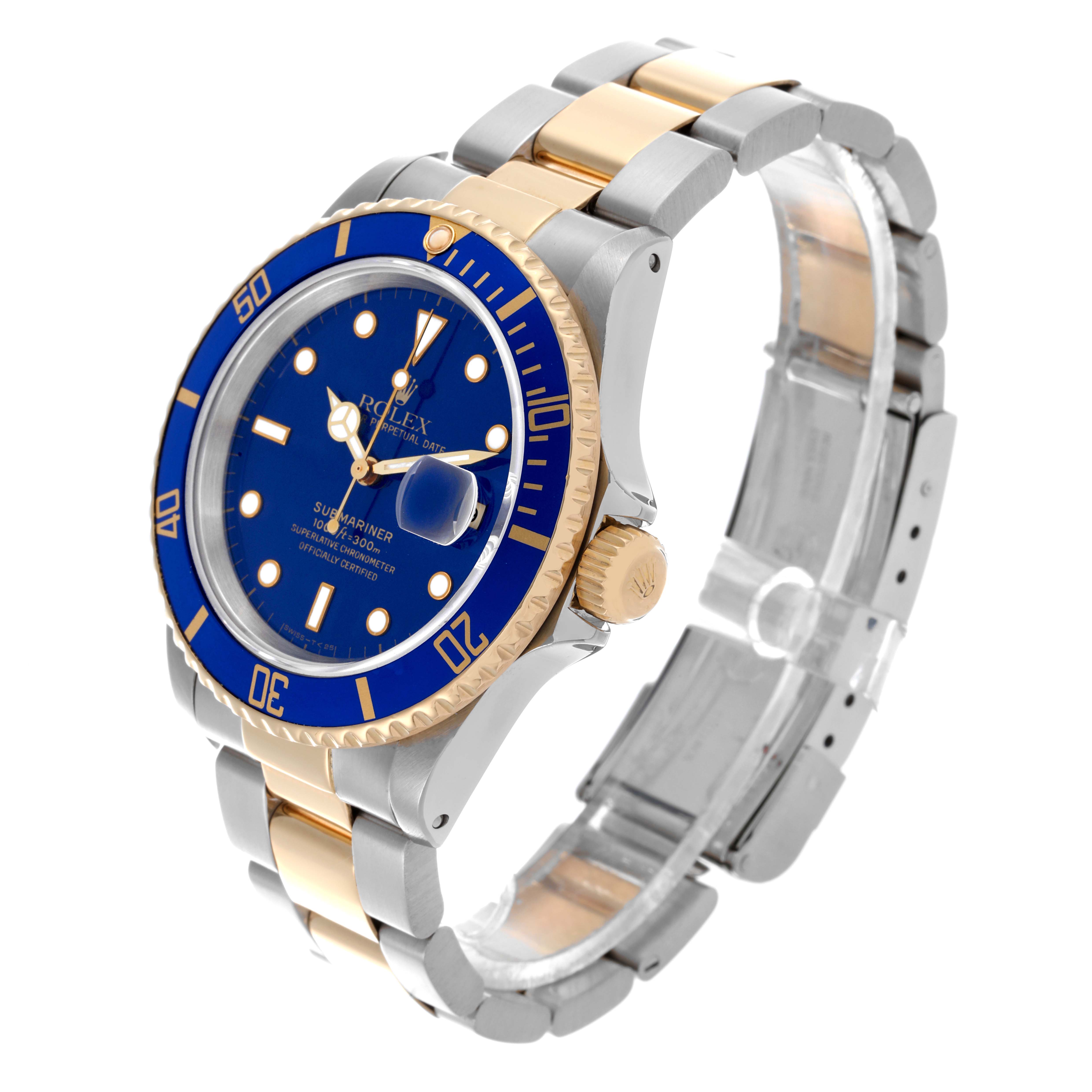 The Rolex Submariner 16613 Men's Steel and Gold (two tone) Blue Dial 16613 Men's Steel and Gold (two tone) Blue Dial watch is shown from a three-quarter angle, highlighting the blue dial, bezel, crown, and two-tone bracelet.