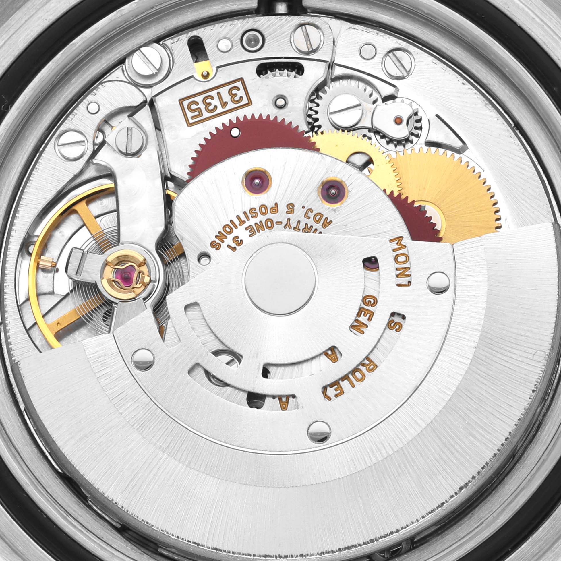 The image shows the internal mechanical movement of a Rolex Submariner 16613 Men's Steel and Gold (two tone) Blue Dial 16613 Men's Steel and Gold (two tone) Blue Dial watch from a close-up, top-down angle.