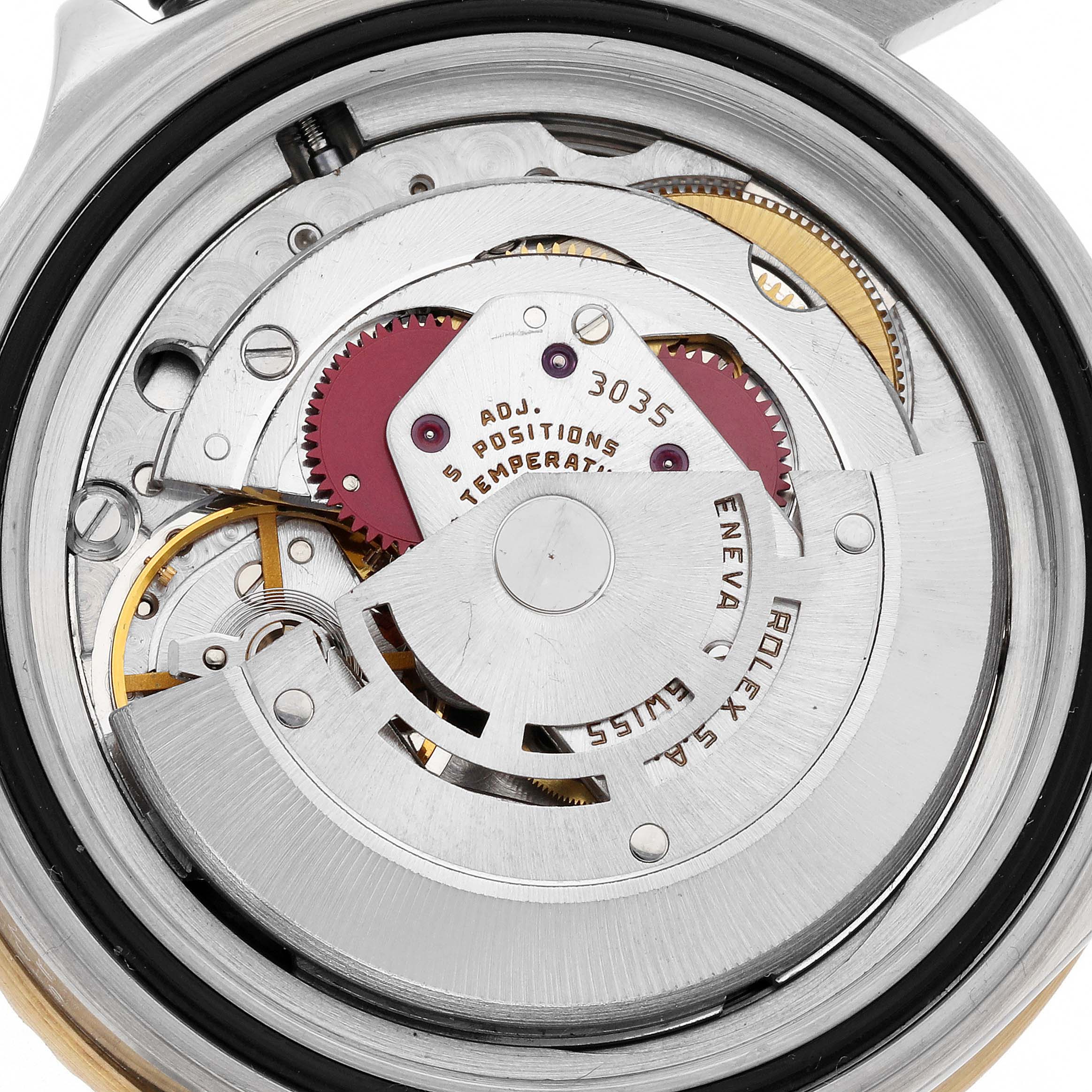 The image shows the movement and inner mechanical components of a Rolex Submariner 16803 Men's Steel and Gold (two tone) Blue Dial 16803 Men's Steel and Gold (two tone) Blue Dial watch from a top-down angle.