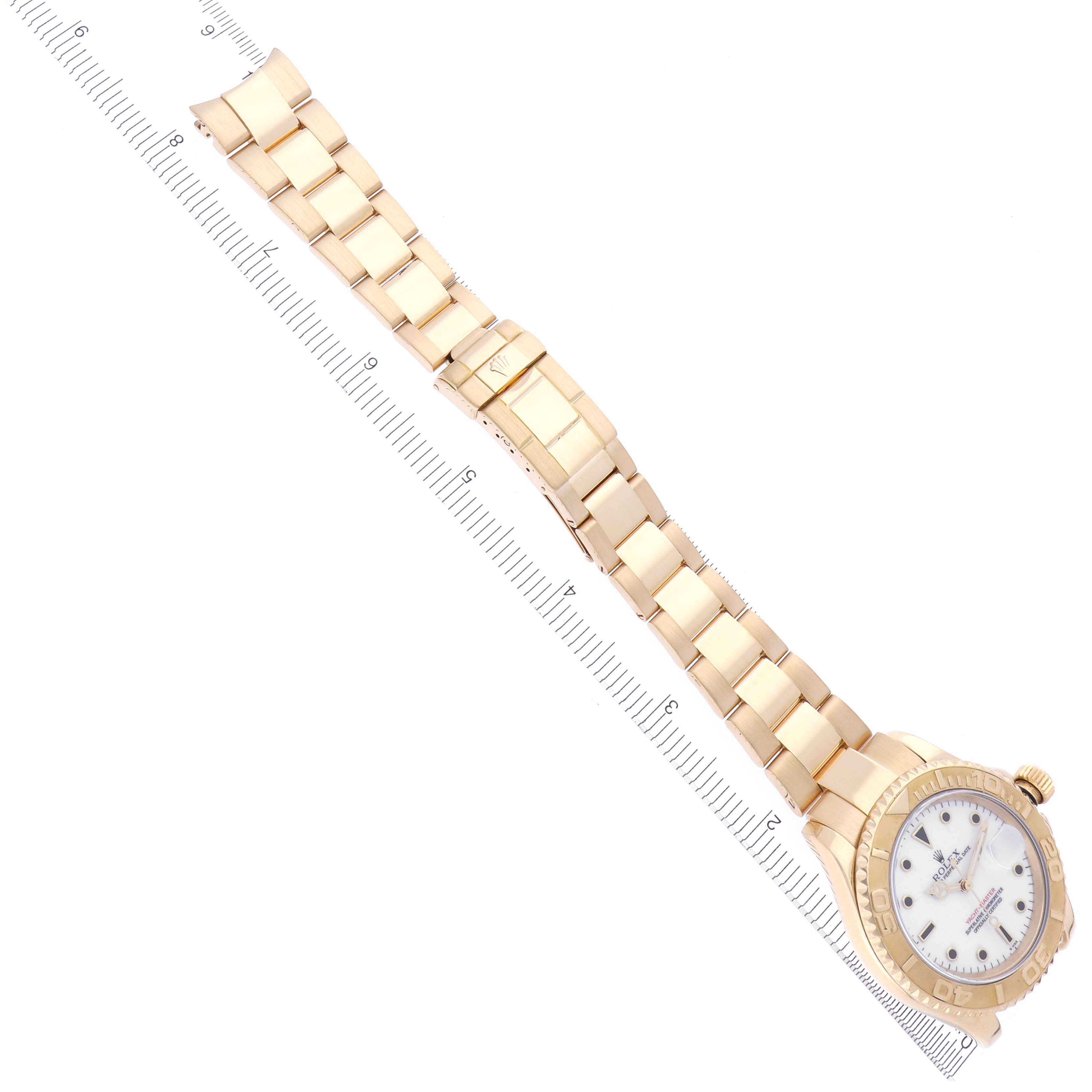 The image shows a Rolex Yacht-Master 16628 Men's Yellow Gold White Dial 16628 Men's Yellow Gold White Dial watch from an overhead angle, featuring the full bracelet and dial.