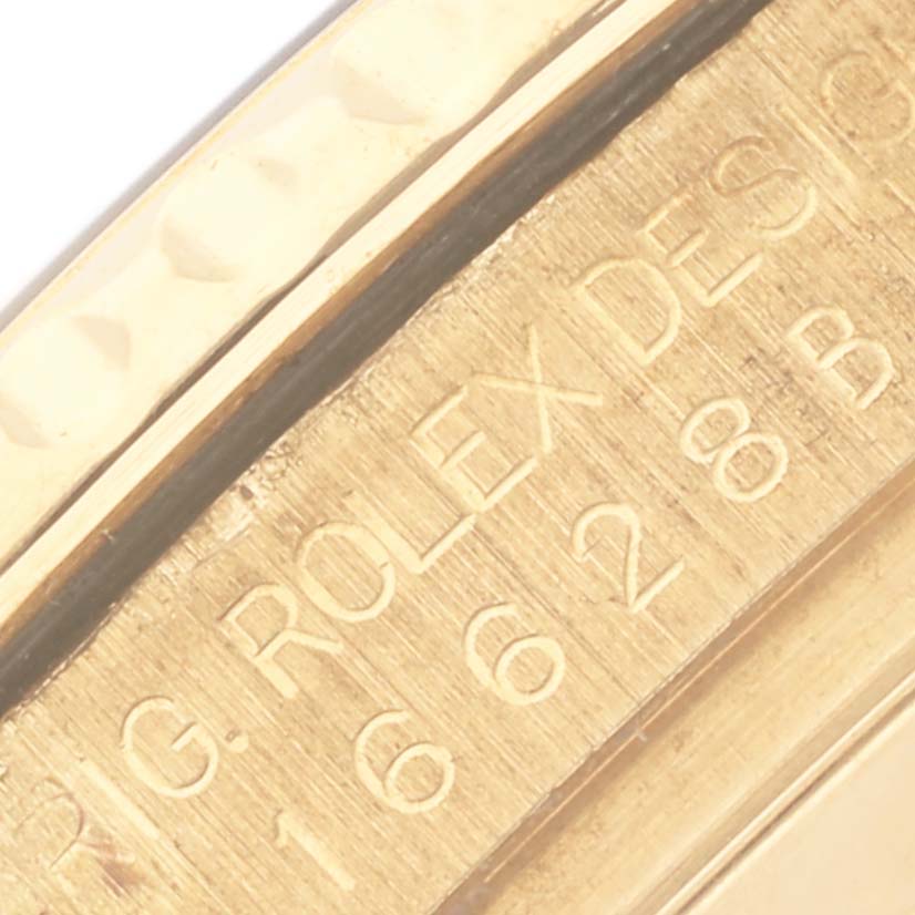 The image shows a close-up of the engraved inner bezel of a Rolex Yacht-Master 16628 Men's Yellow Gold White Dial 16628 Men's Yellow Gold White Dial watch.