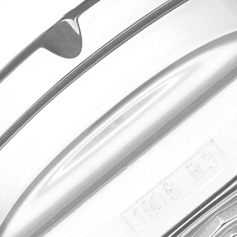 This close-up shows the side and part of the back case of the Breitling Bentley A13362 Men's Stainless Steel White Dial A13362 Men's Stainless Steel White Dial watch, featuring an engraved detail.