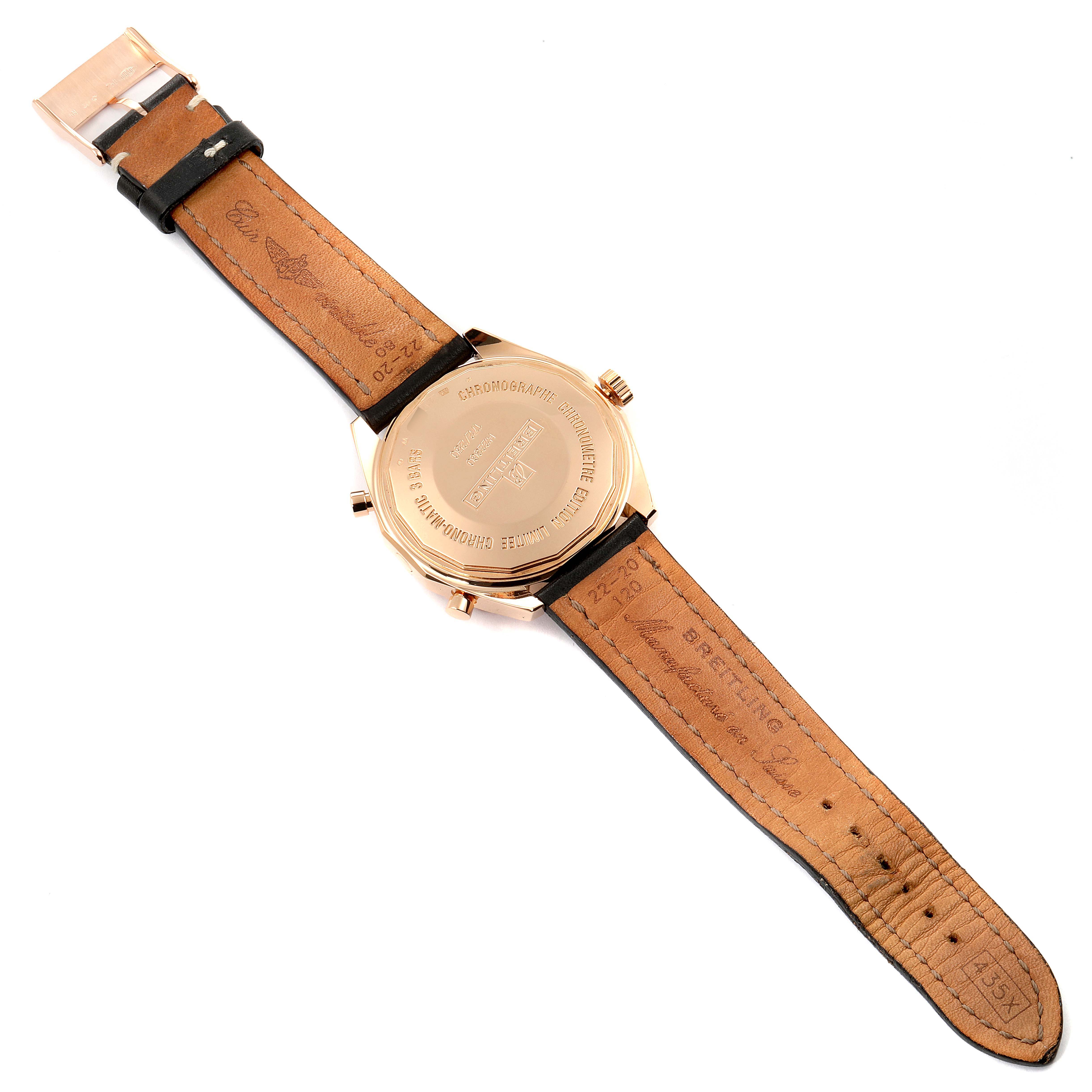 The image shows the back and leather strap of a Breitling Chronomatic H22360 Men's Rose Gold Black Dial H22360 Men's Rose Gold Black Dial watch laid flat.