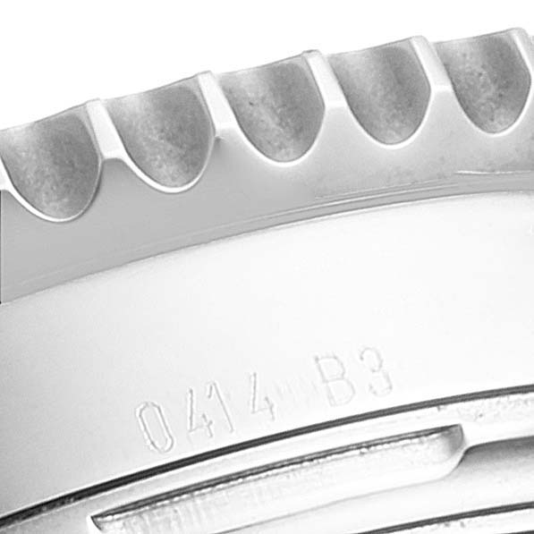 The image shows a close-up of the bezel and part of the case of a Breitling Navitimer AB0121C4-Q605-739P-A20BA.1 Men's Stainless Steel Brown Dial AB0121C4-Q605-739P-A20BA.1 Men's Stainless Steel Brown Dial watch.