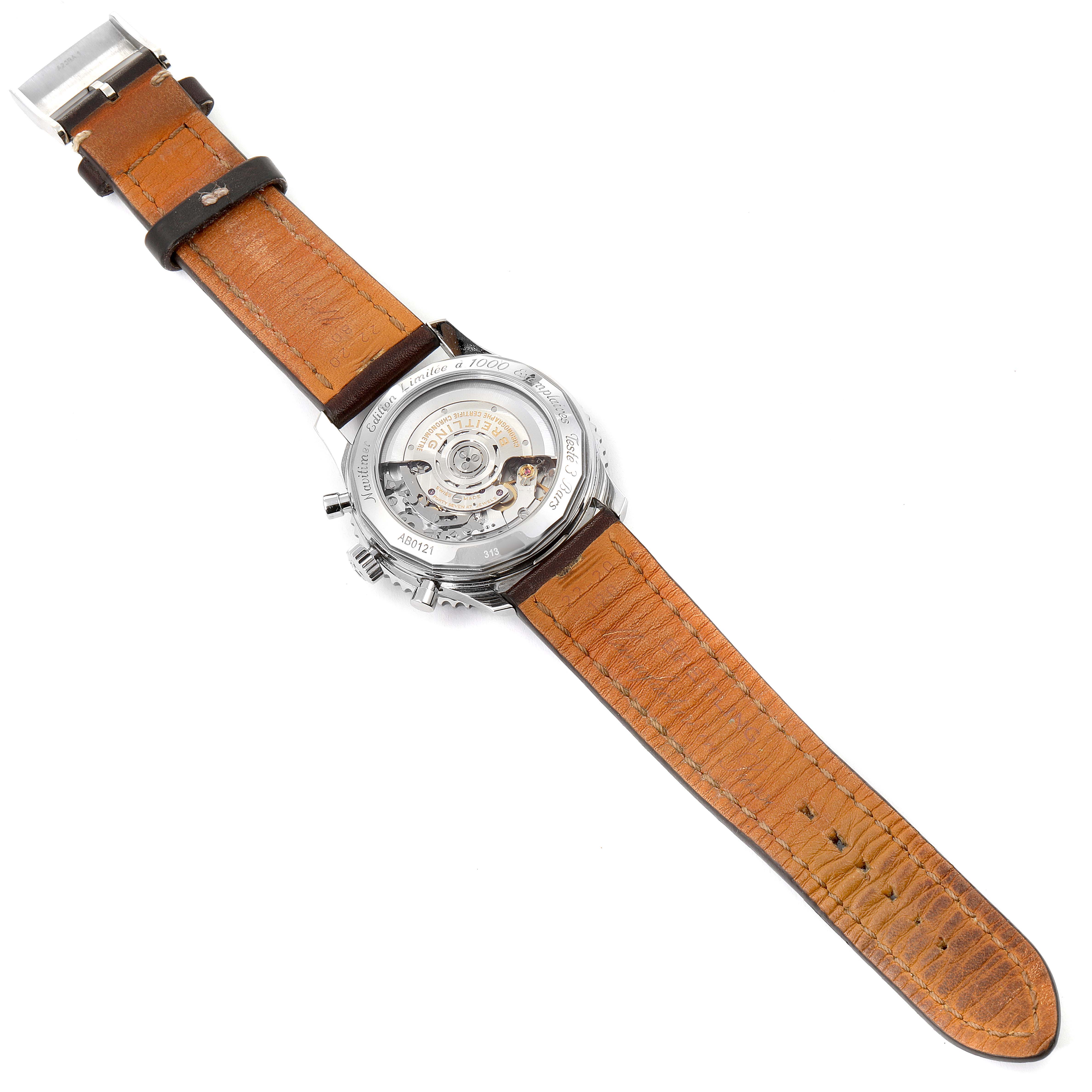 The image shows the back view of a Breitling Navitimer AB0121C4-Q605-739P-A20BA.1 Men's Stainless Steel Brown Dial AB0121C4-Q605-739P-A20BA.1 Men's Stainless Steel Brown Dial watch, revealing its leather strap and exposed movement.