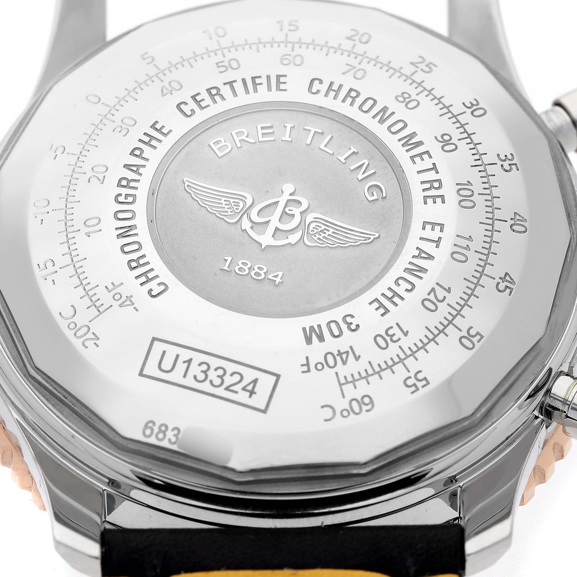 The image shows the back case of a Breitling Navitimer U13324 Men's Stainless Steel Black Dial watch, displaying engravings and the model number.