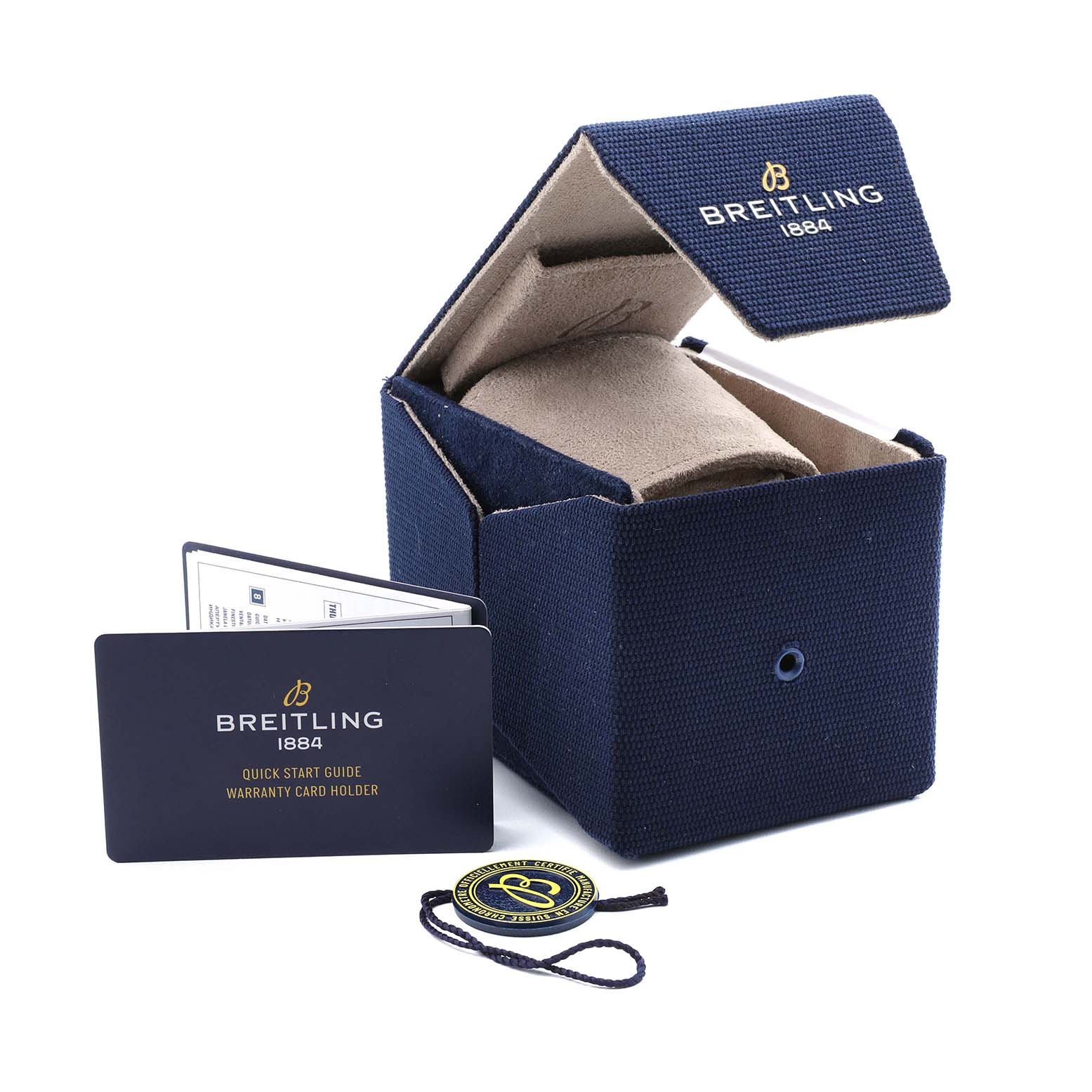 The Breitling Navitimer U13324 Men's Stainless Steel Black Dial accessories include a blue box, warranty card, and tag, viewed from an angled perspective.