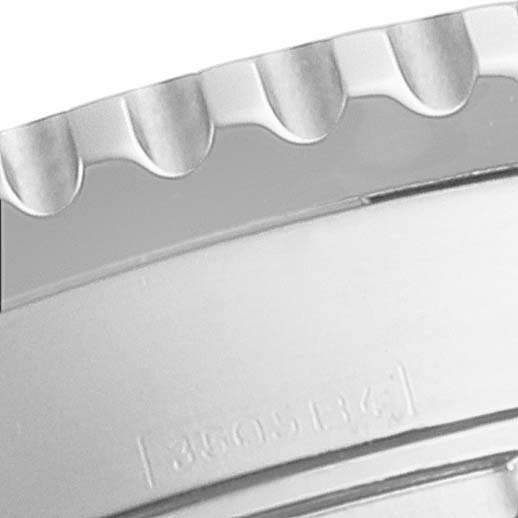 This close-up angle shows the textured bezel and part of the case of a Breitling Navitimer A23322 Men's Stainless Steel Black Dial A23322 Men's Stainless Steel Black Dial watch.