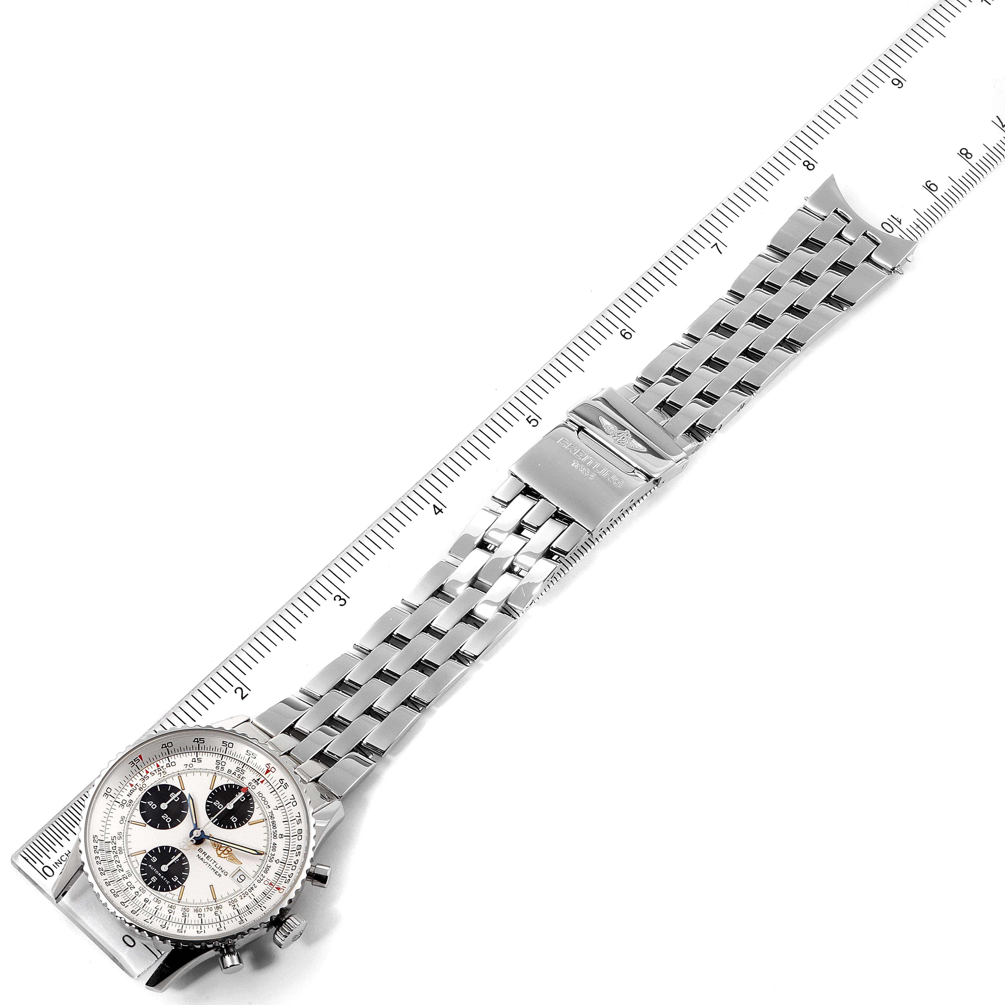 The image shows a Breitling Navitimer A13022 Men
s Stainless Steel Silver Dial A13022 Men
s Stainless Steel Silver Dial watch laid flat with a focus on the dial, bracelet, and clasp, alongside a ruler for scale.