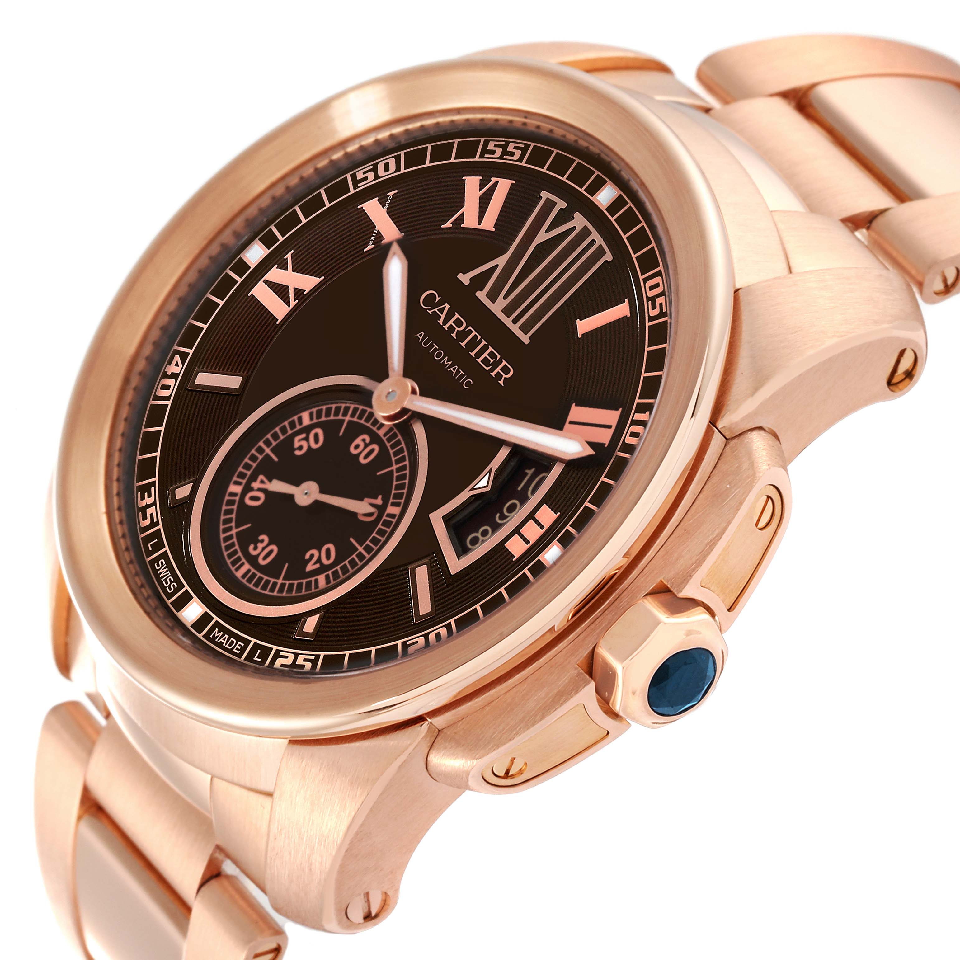 The image shows a close-up, angled view of the Calibre de Cartier watch by Cartier, highlighting the dial, bezel, and crown.