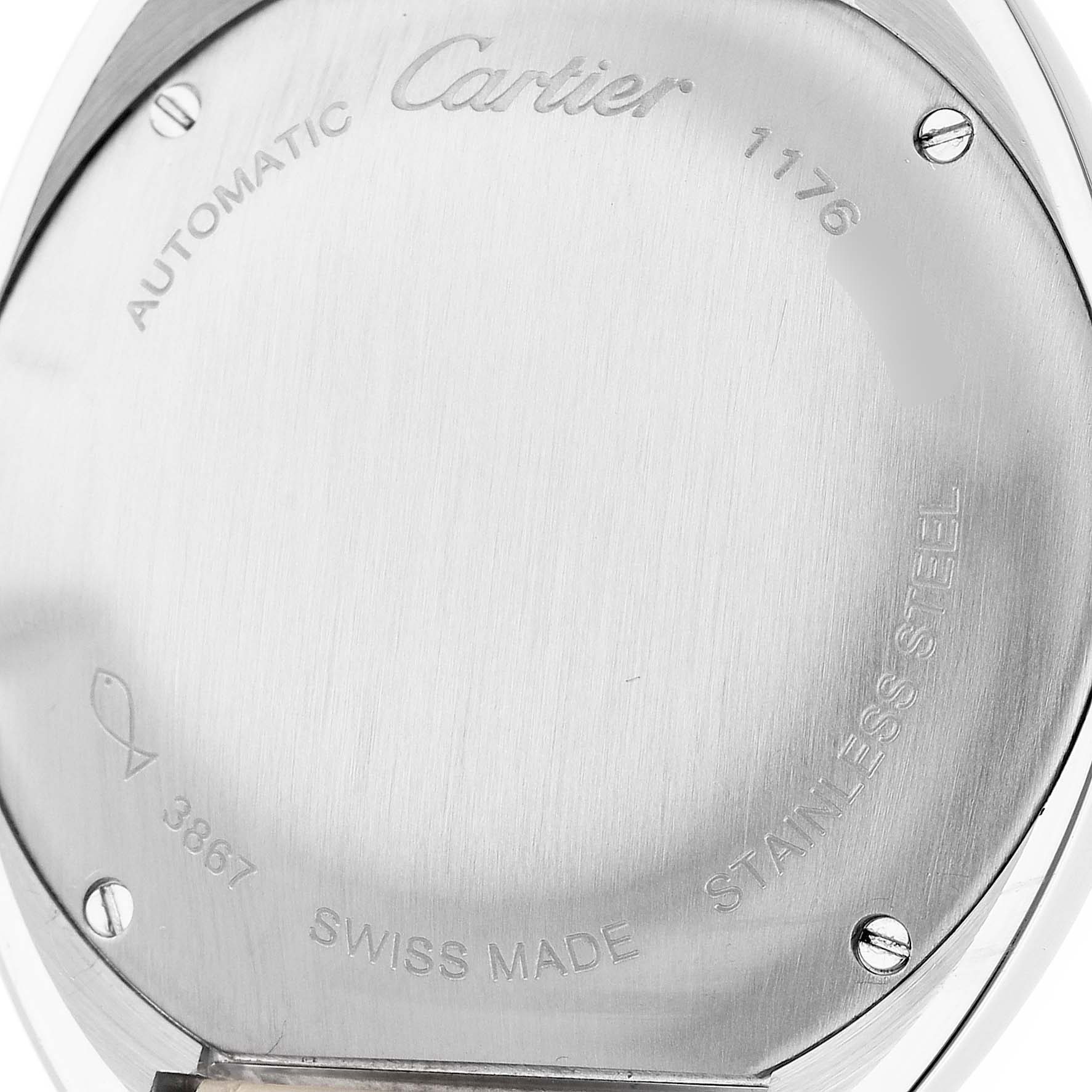 The image shows the back of a Cle de Cartier watch, highlighting its screws, brand engravings, and "Swiss Made" inscription.