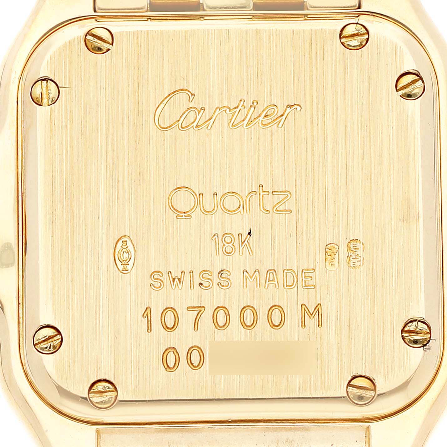 The image shows the back of a Panthere model Cartier watch, highlighting the engravings and screws.