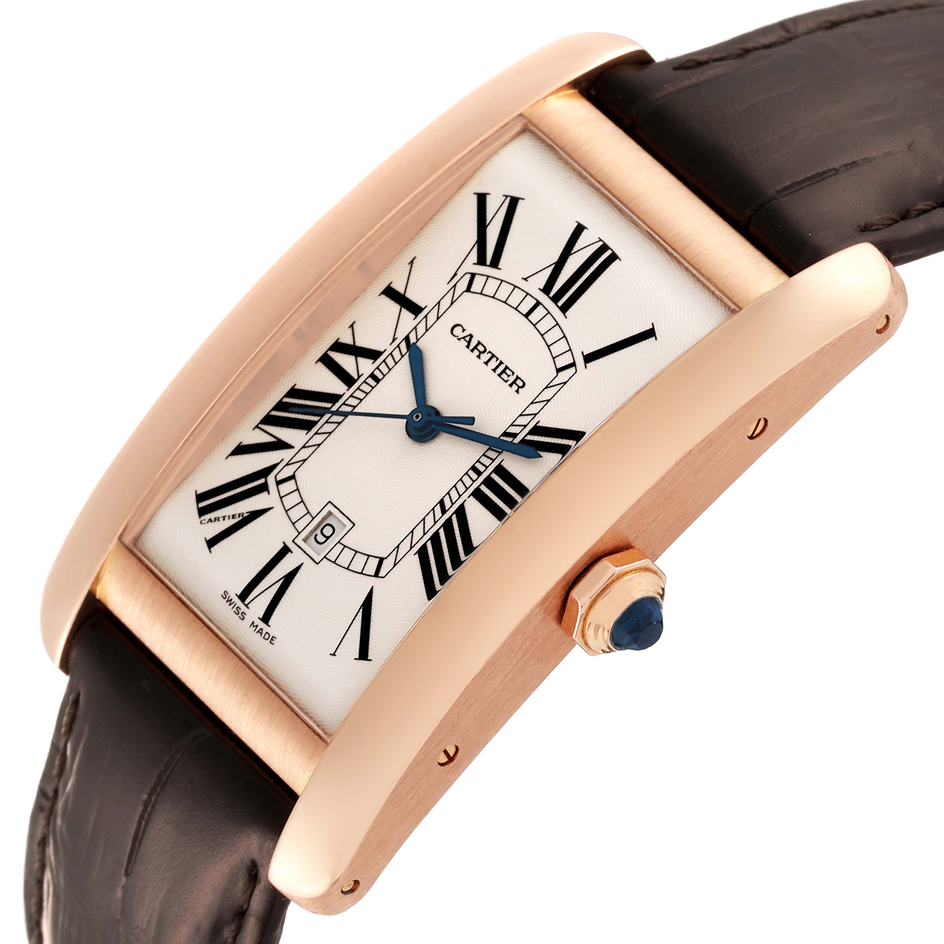 This image displays a Tank Americaine watch by Cartier shown at a slight upward angle, highlighting the dial, case, crown, and strap.