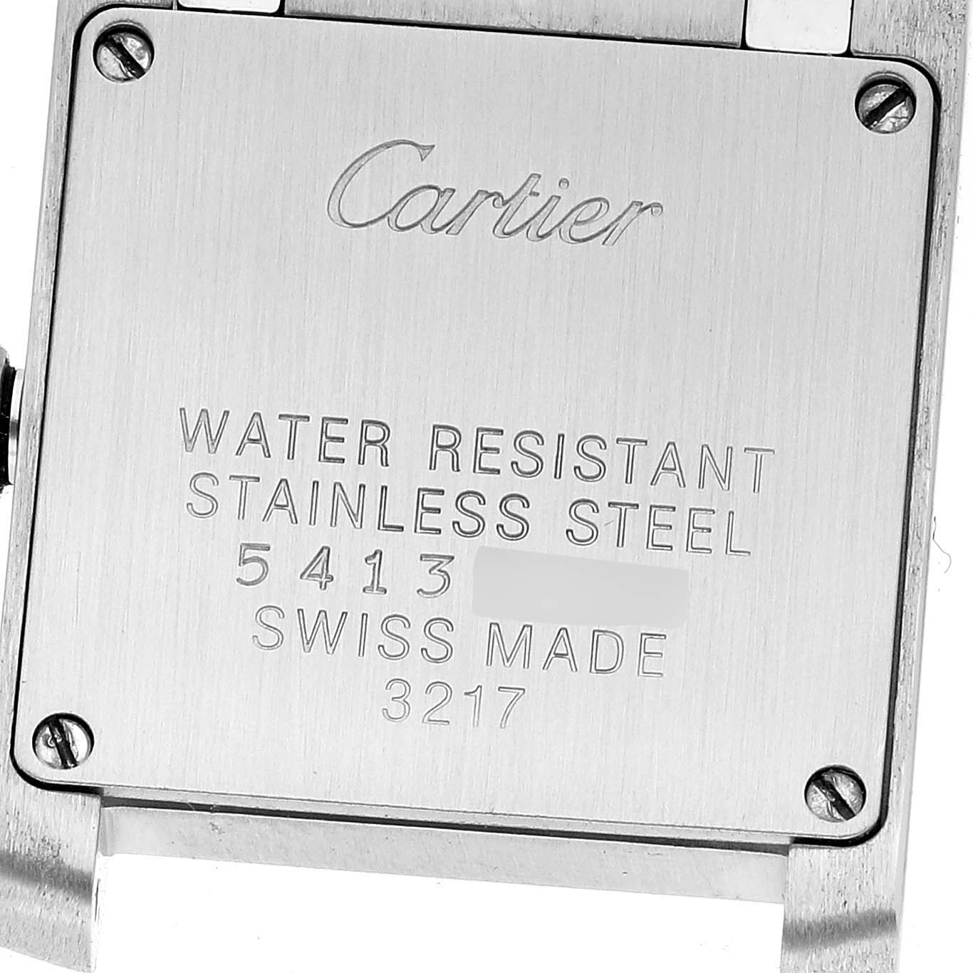 This is a close-up of the back case of a Cartier Tank Francaise WE110006 Women's Stainless Steel Silver Dial WE110006 Women's Stainless Steel Silver Dial watch, showing engraved text and screws.
