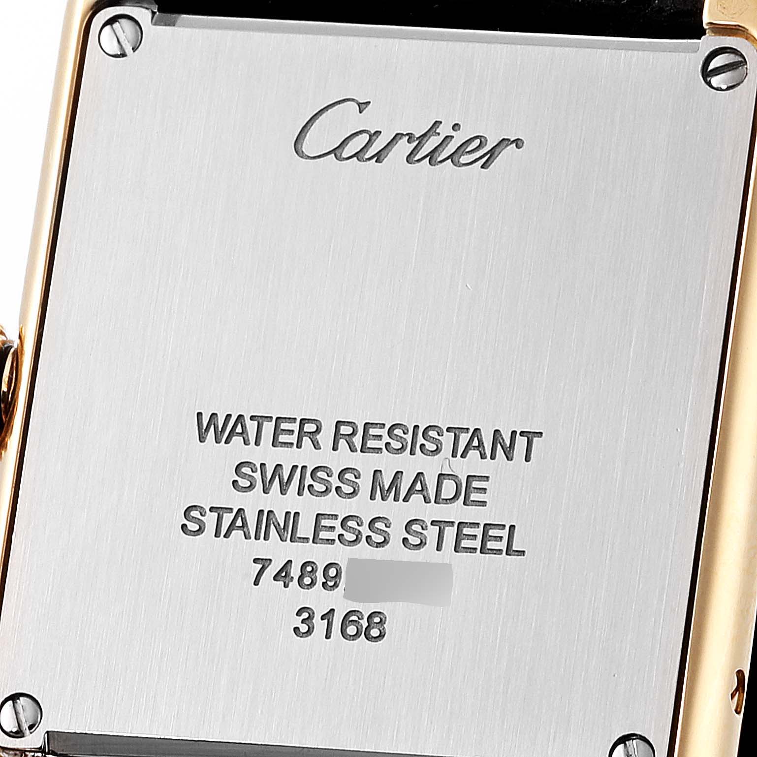 The image shows the back of a Cartier Tank Solo W5200002 Women's Yellow Gold Silver Dial W5200002 Women's Yellow Gold Silver Dial watch, highlighting its stainless steel case and engravings.