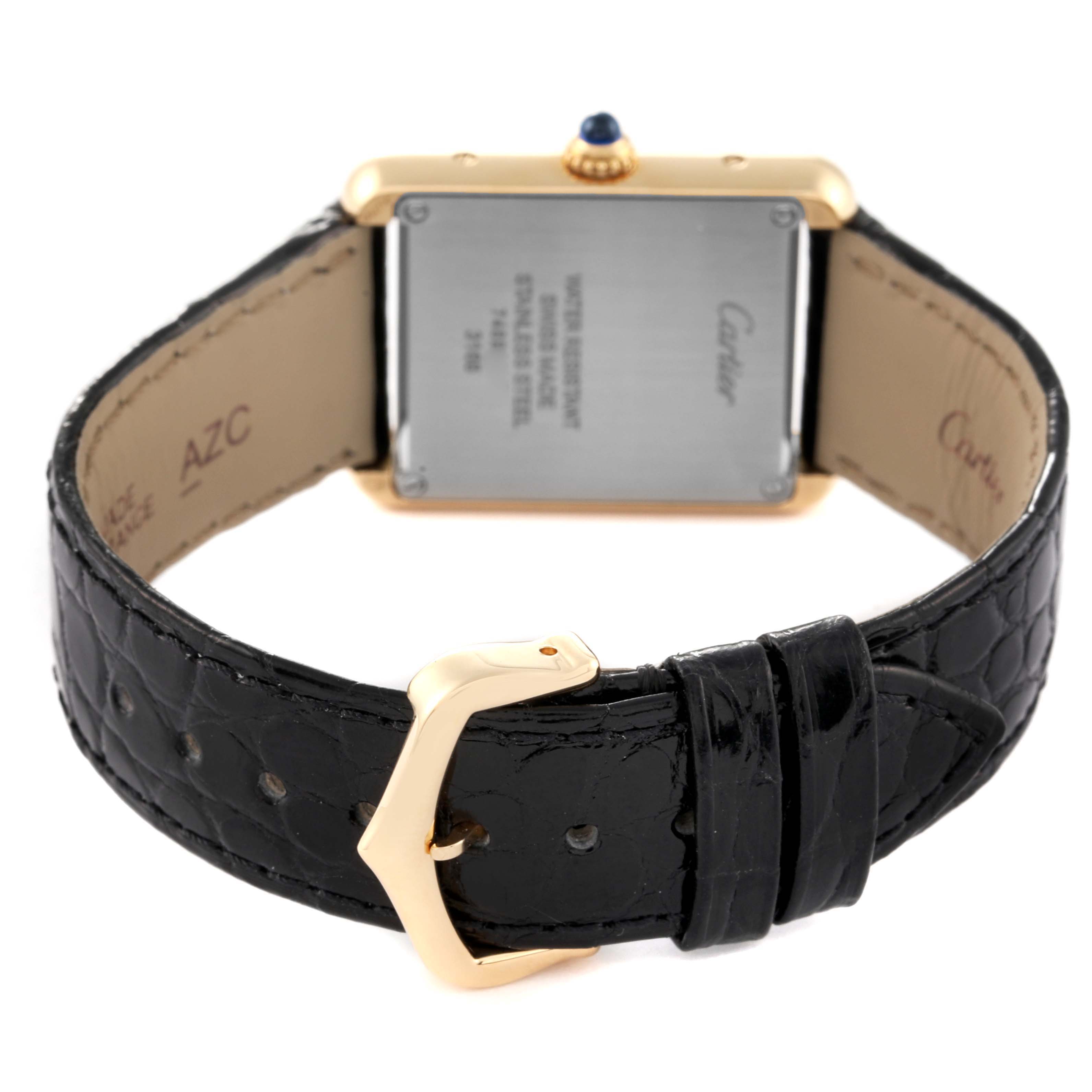 The image shows the back view of a Cartier Tank Solo W5200002 Women's Yellow Gold Silver Dial W5200002 Women's Yellow Gold Silver Dial watch, including the case back and its black leather strap with a gold buckle.