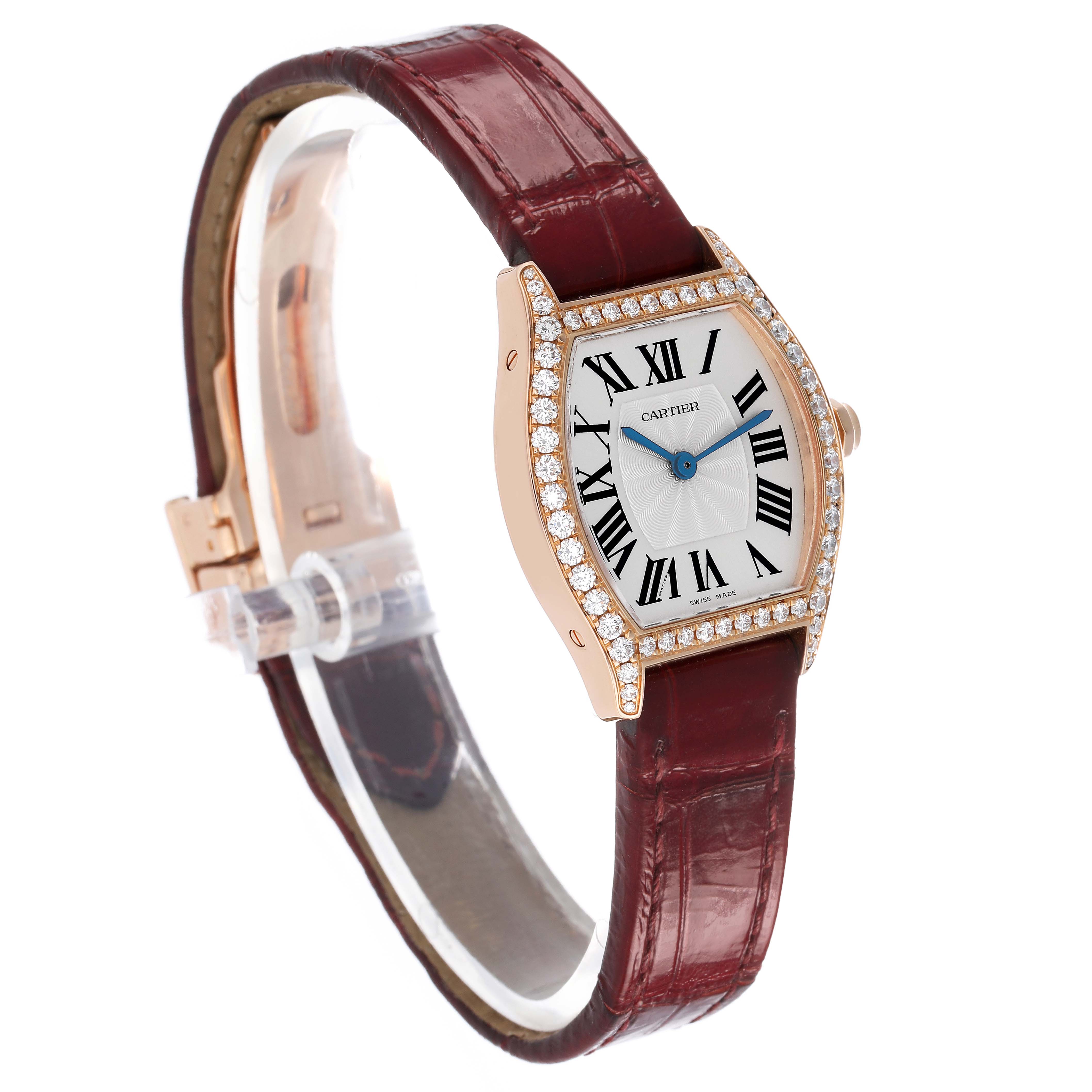 The Cartier Tortue WA501010 Women's Rose Gold Silver Dial watch is shown at a slight angle, highlighting the diamond bezel, dial, and maroon leather strap.