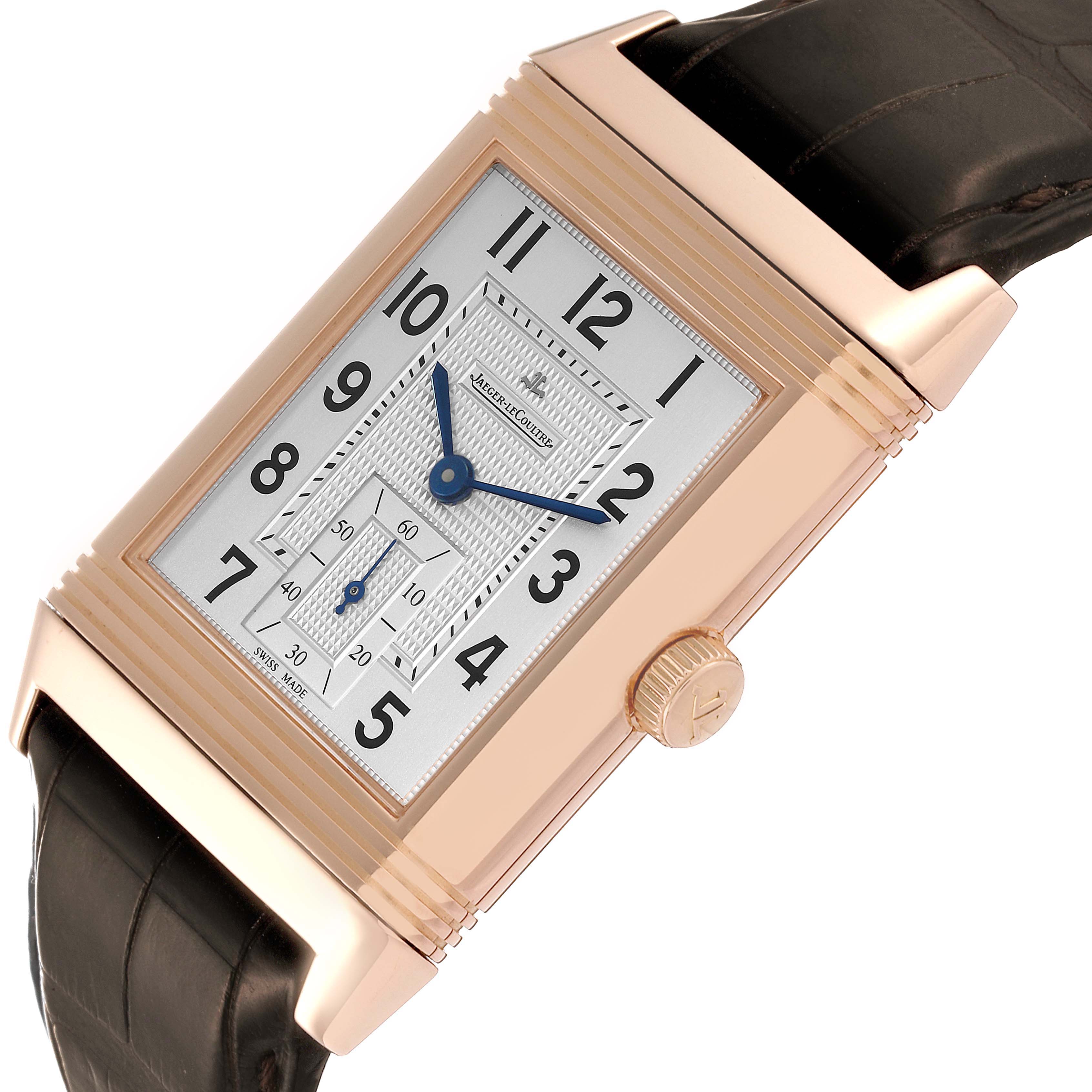 This is an angled close-up of the Jaeger LeCoultre Reverso Q3732420 Men's Rose Gold Silver Dial Q3732420 Men's Rose Gold Silver Dial watch, showing the face, bezel, crown, and part of the strap.