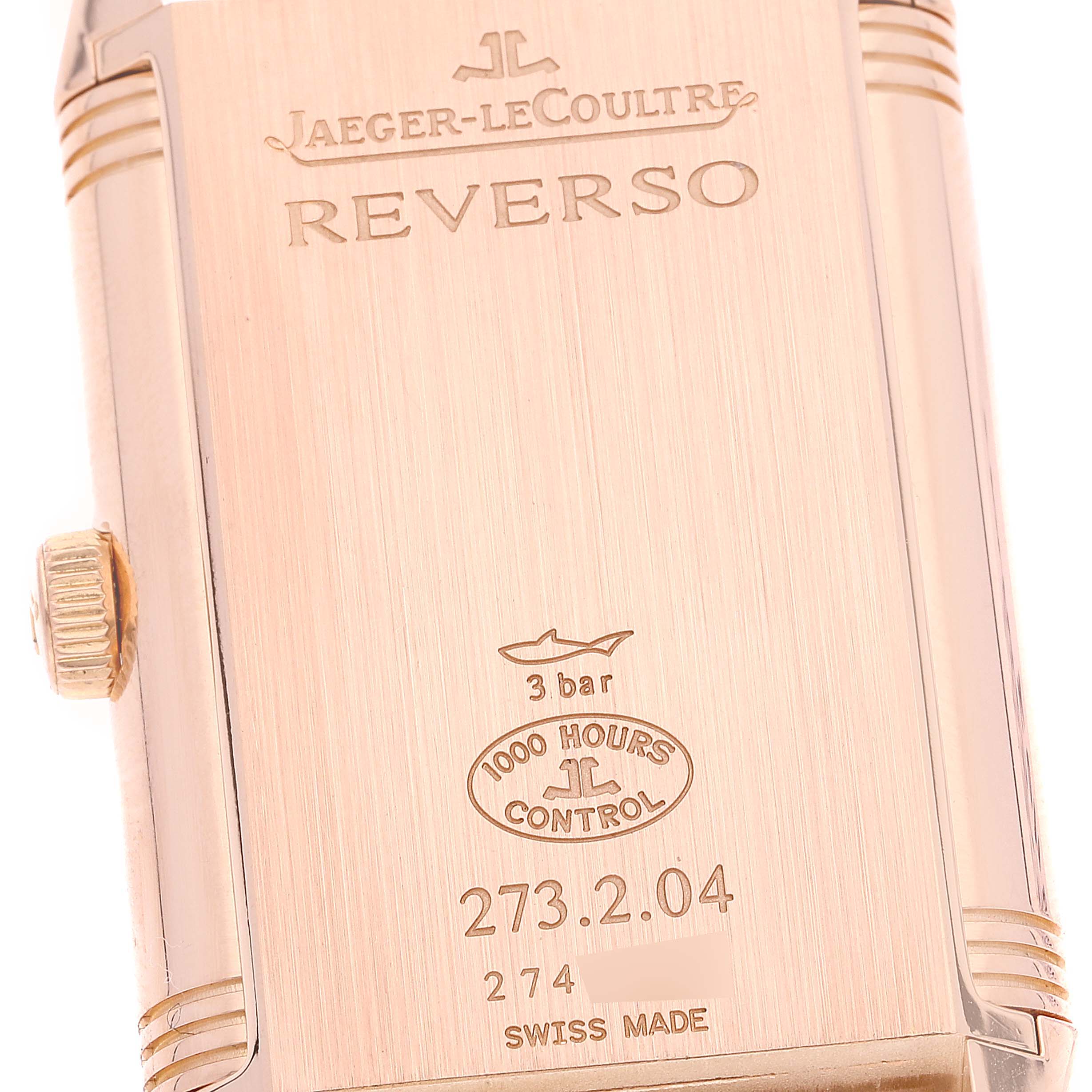 The image shows the back of a Jaeger-LeCoultre Reverso watch case from a close-up angle.
