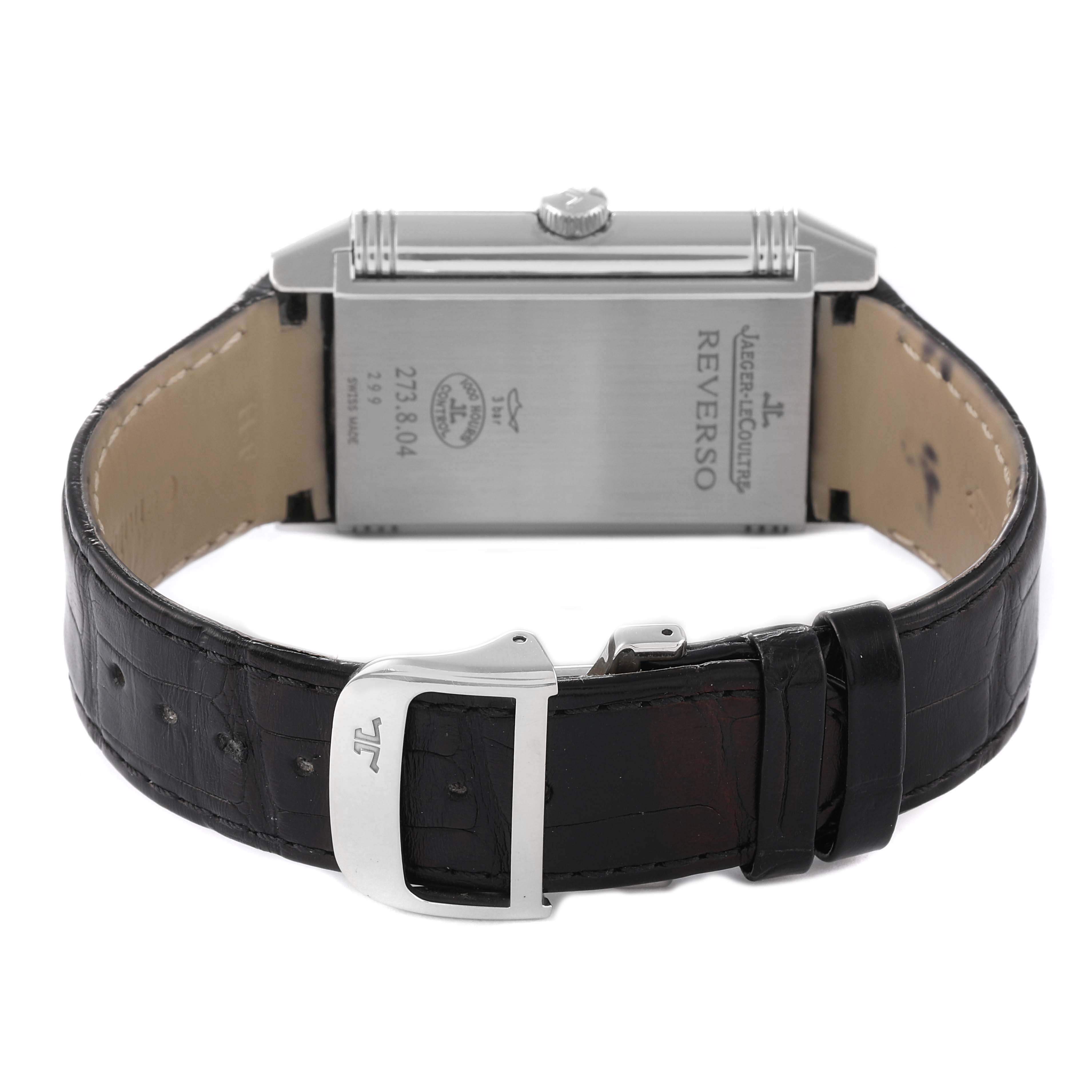 This is a rear view of the Jaeger-LeCoultre Reverso watch showing the case back and leather strap with buckle.