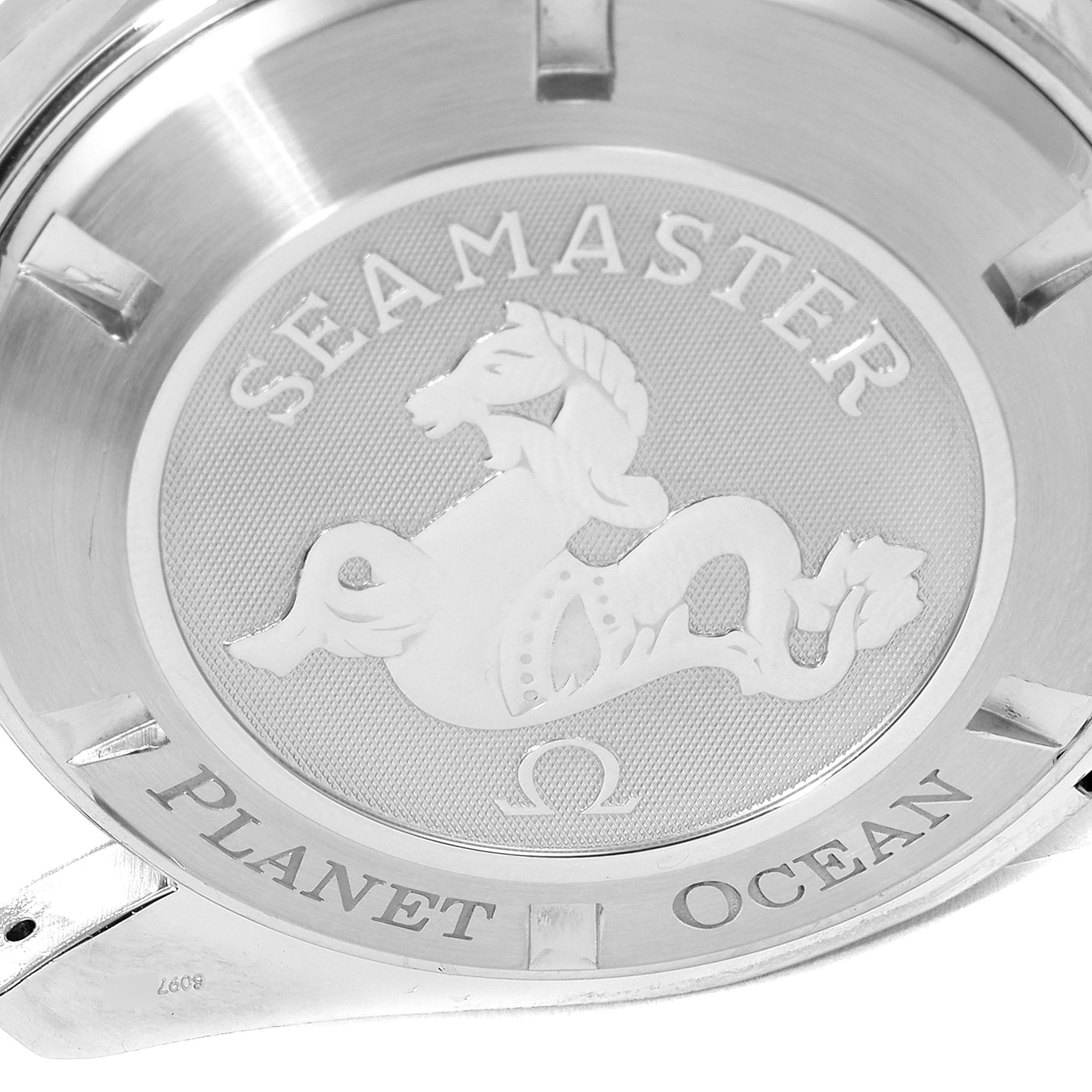 This is an angled close-up shot of the Omega Planet Ocean 2908.50.91 Men
s Stainless Steel Black Dial 2908.50.91 Men
s Stainless Steel Black Dial watch
s case back, showcasing the Seamaster engravings.