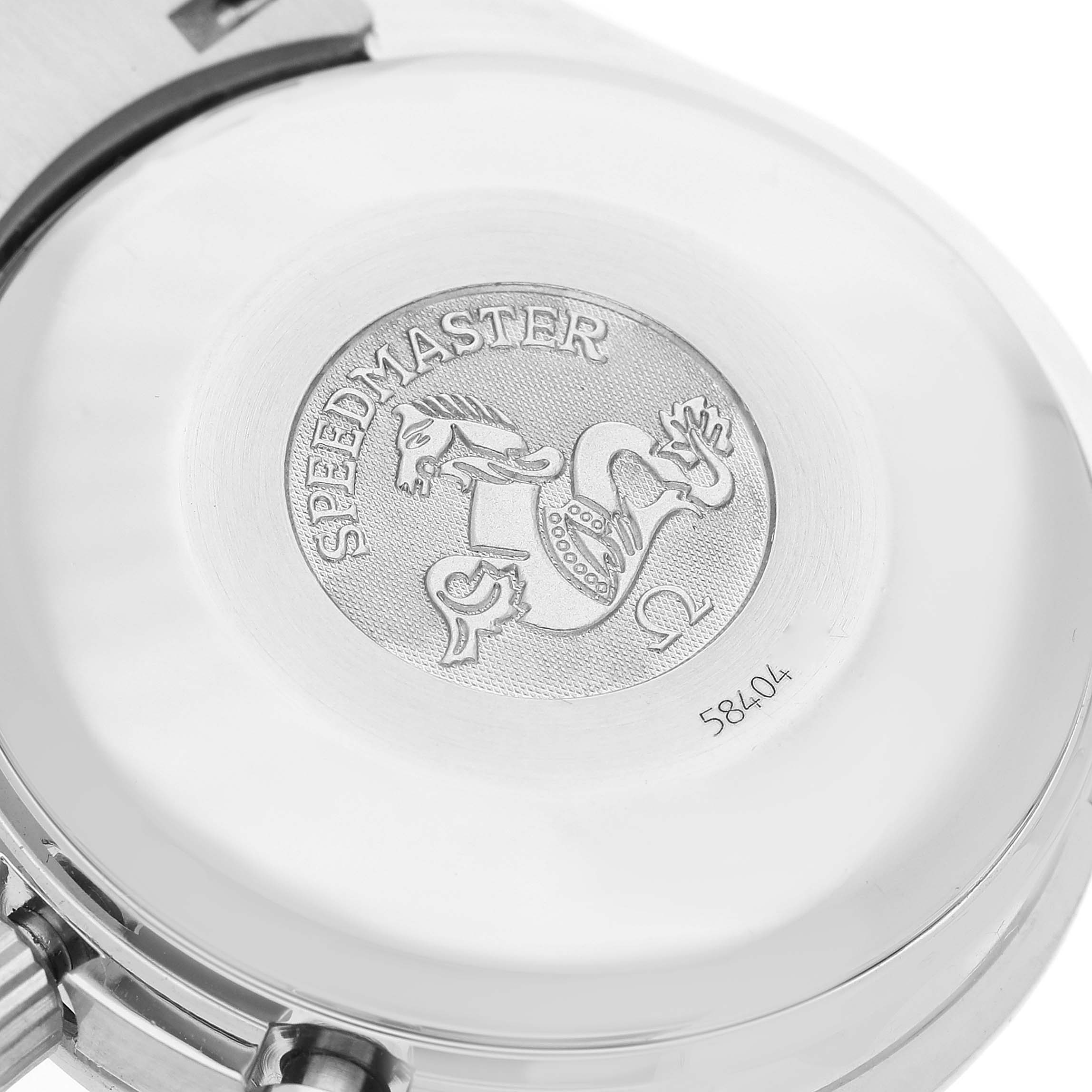 The image shows the back casing of an Omega Speedmaster 3513.30.00 Men
s Stainless Steel Silver Dial 3513.30.00 Men
s Stainless Steel Silver Dial watch, displaying its engraved logo and serial number.