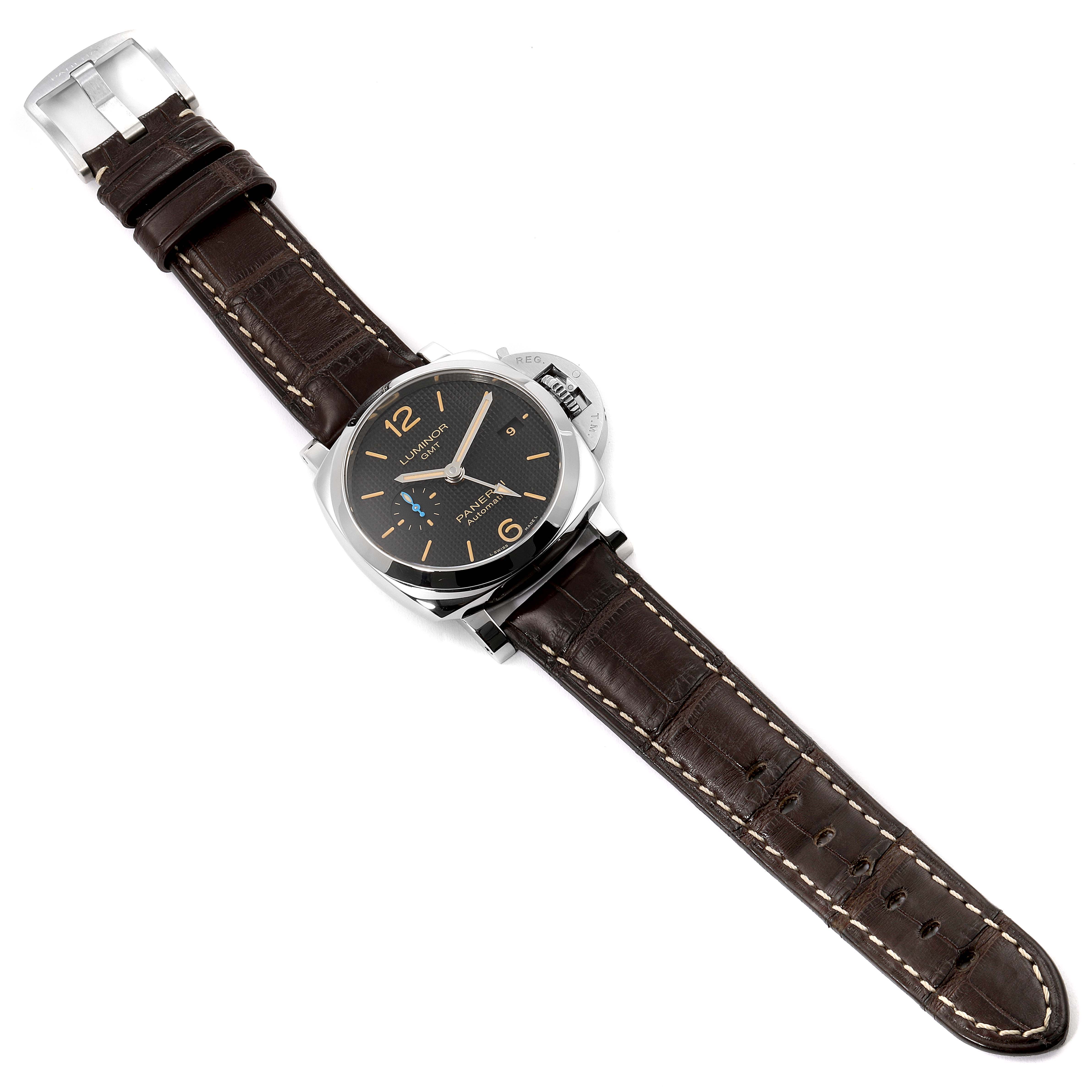 The Panerai Luminor PAM01535 Men
s Stainless Steel Black Dial PAM01535 Men
s Stainless Steel Black Dial watch is shown from an overhead angle, displaying its face, case, crown, and brown leather strap.