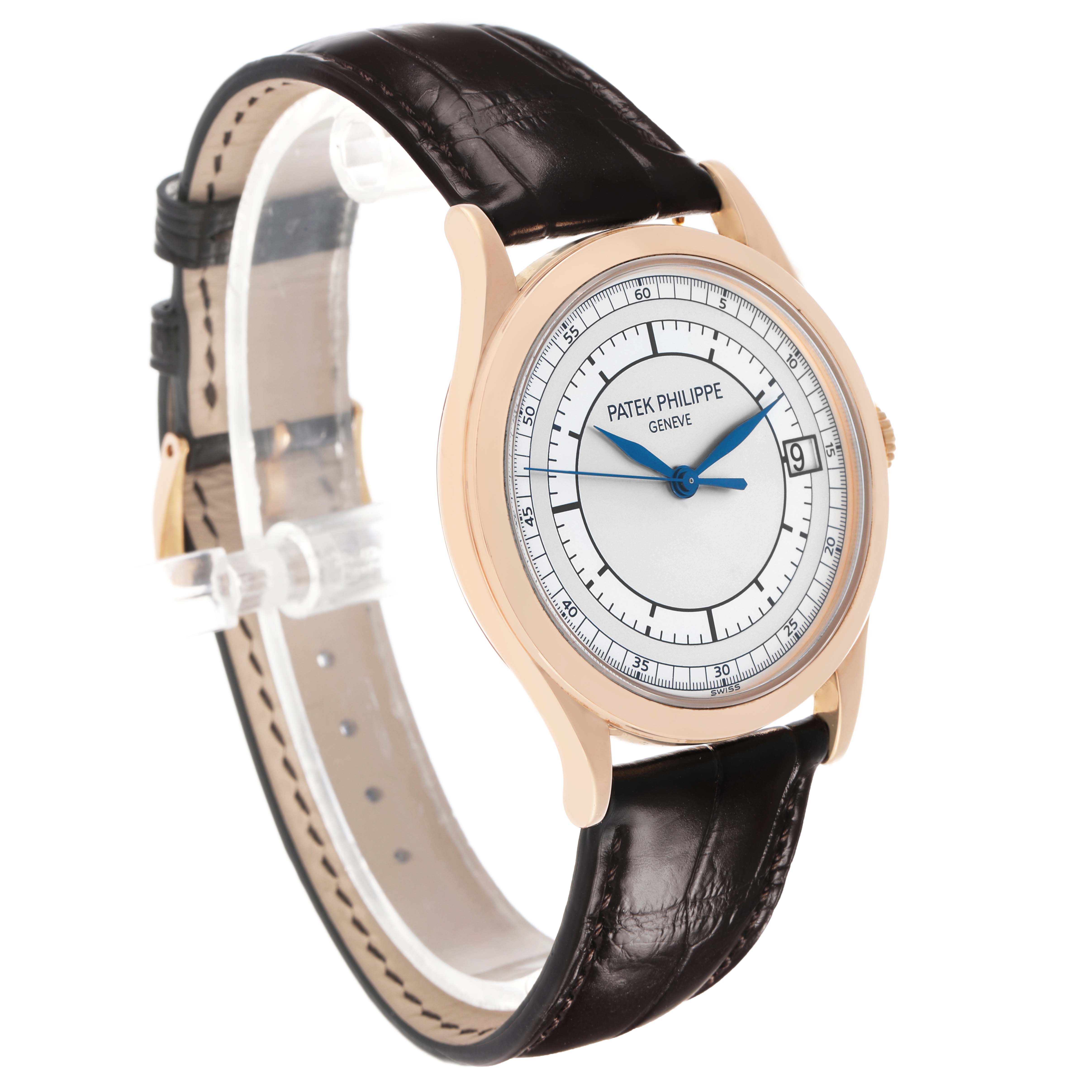 The Patek Philippe Calatrava 5296R-001 Men's Rose Gold Silver Dial watch is shown at an angled side view, featuring the case, dial, crown, and leather strap.
