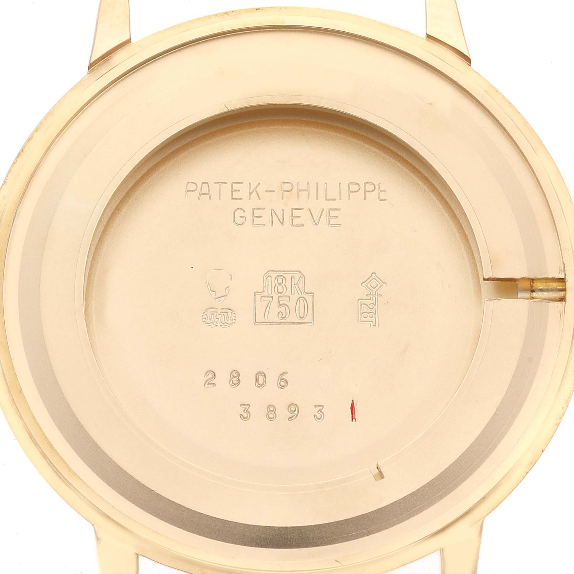 The image shows the inside of the case back of a Patek Philippe Calatrava 3893J Men
s Yellow Gold White Dial 3893J Men
s Yellow Gold White Dial watch, highlighting its engravings and hallmarks.