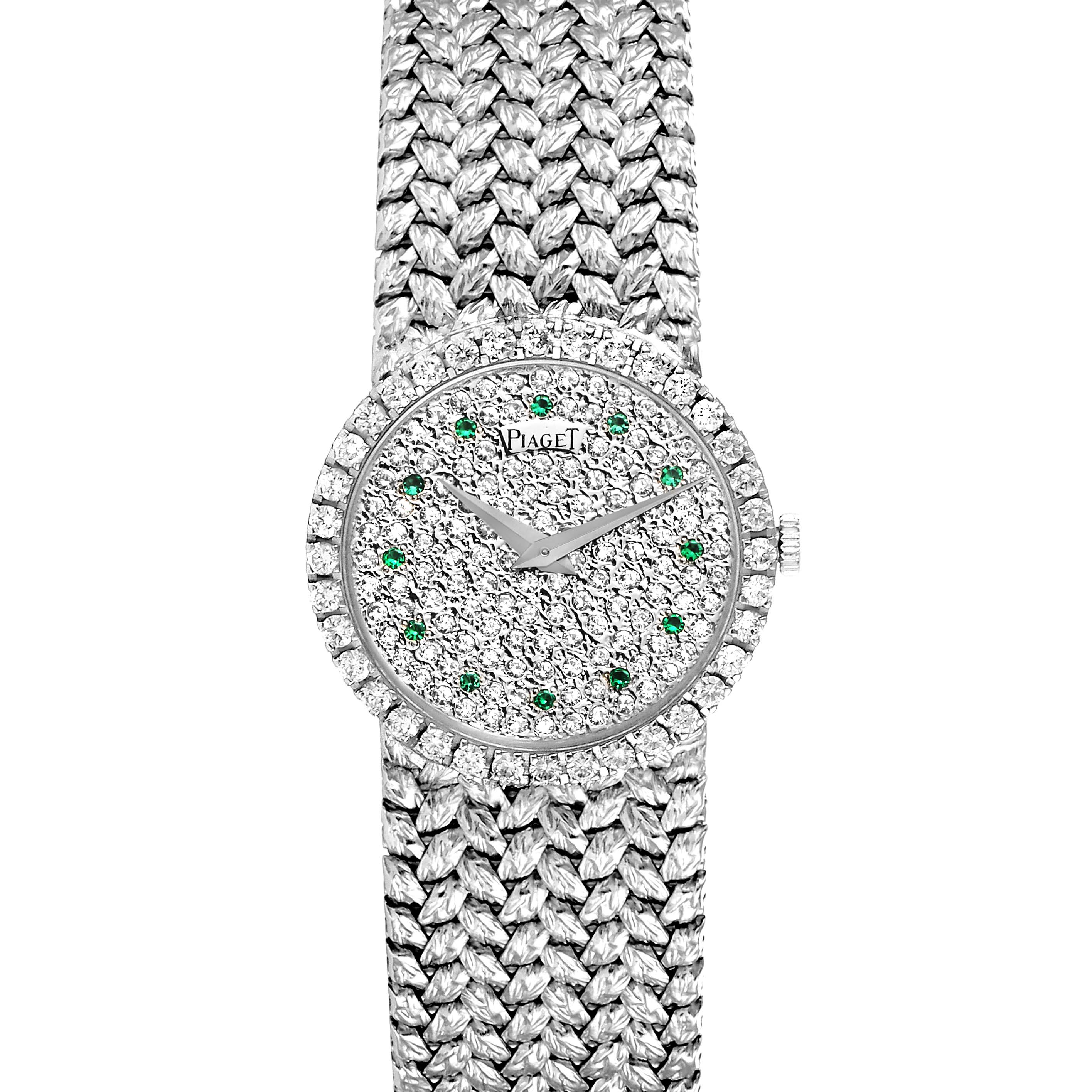 The Piaget 9706 Women's White Gold  9706 Women's White Gold  9706 model is shown from a top-down angle, displaying the diamond and emerald dial, and white gold bracelet.