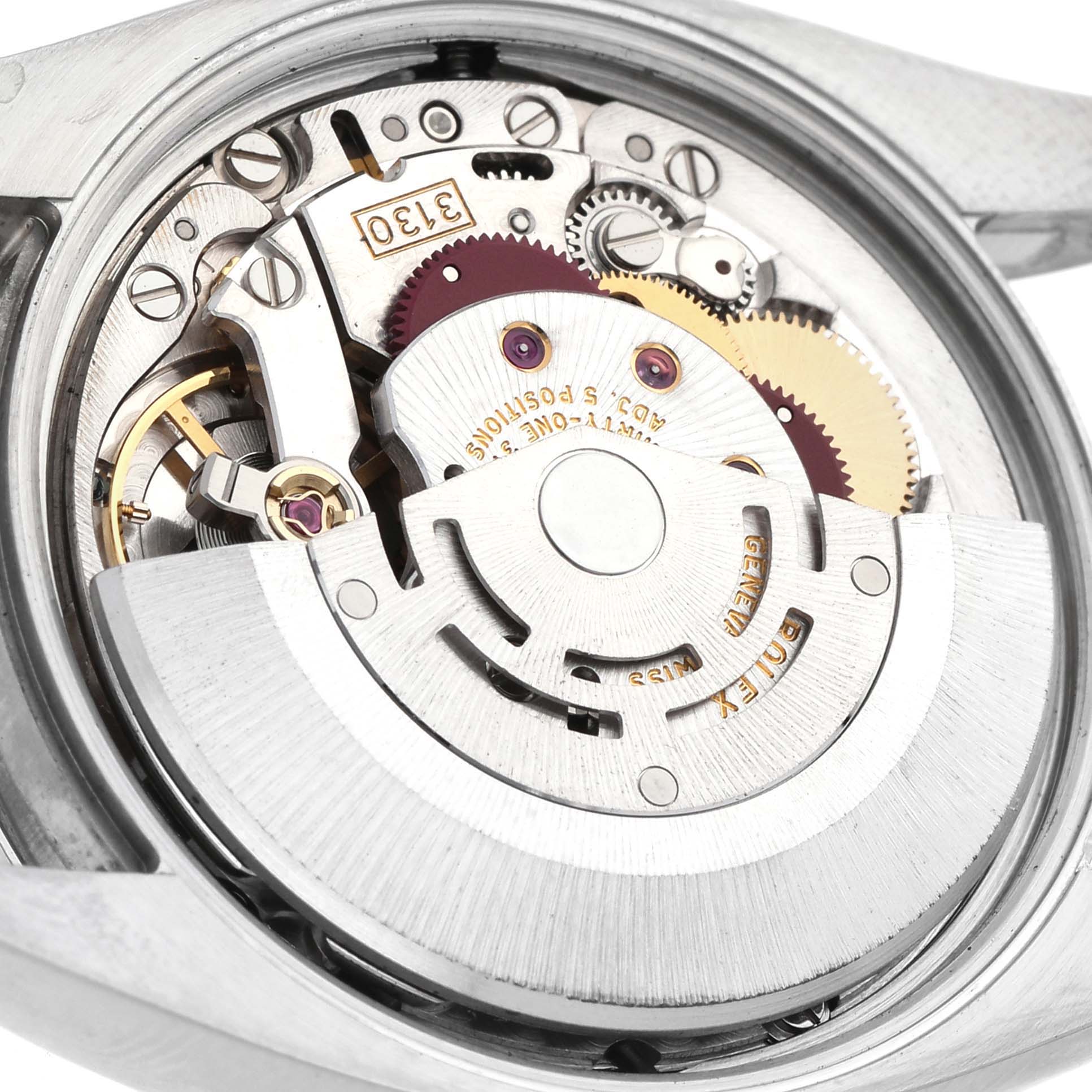 The image shows the internal mechanism of the Rolex Air-King 114200 Men's Stainless Steel White Dial watch viewed from the back, focusing on its movement components.
