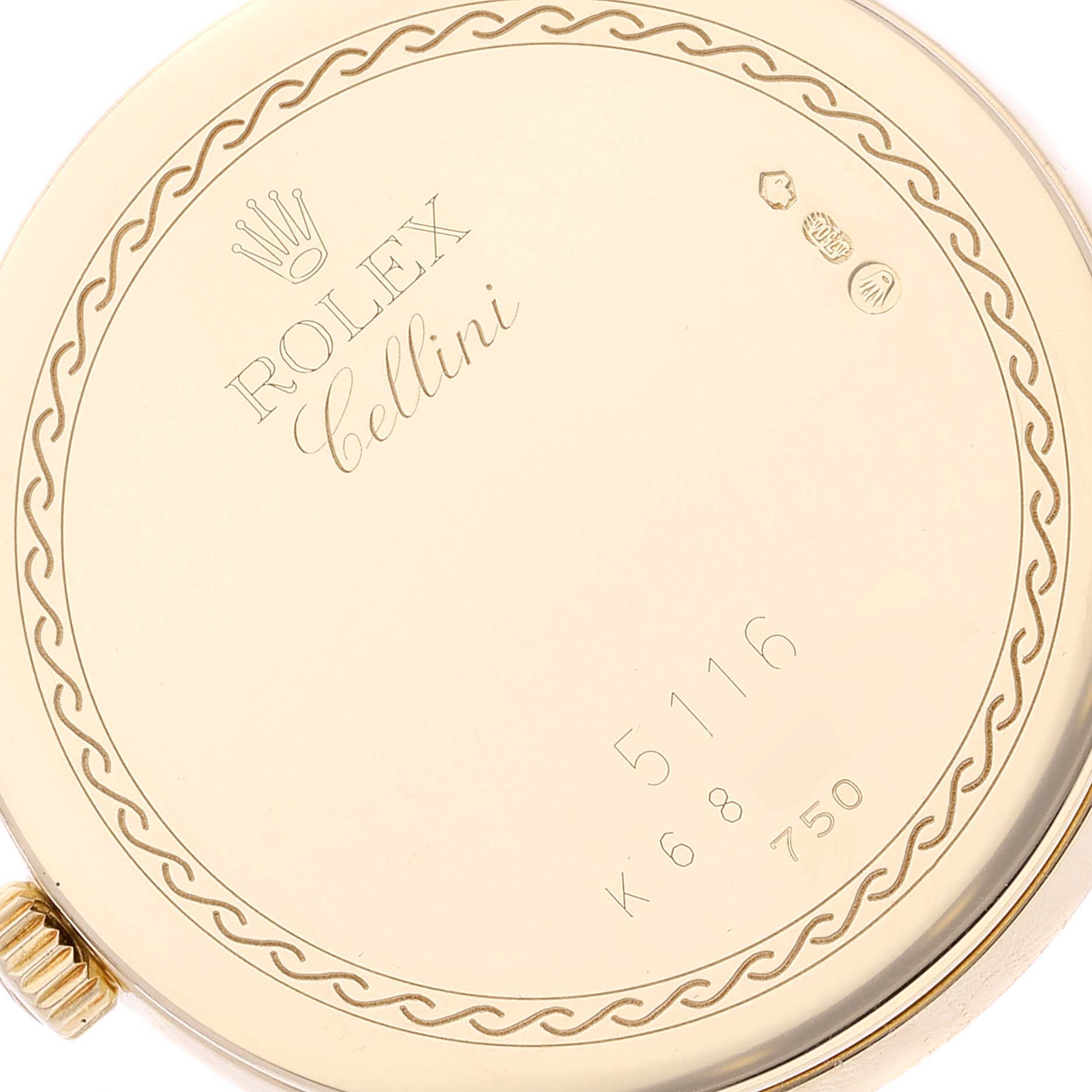The image shows the back of a Rolex Cellini 5116/8 Men's Yellow Gold Beige Dial 5116/8 Men's Yellow Gold Beige Dial watch, showcasing its logo, model number, and decorative border.