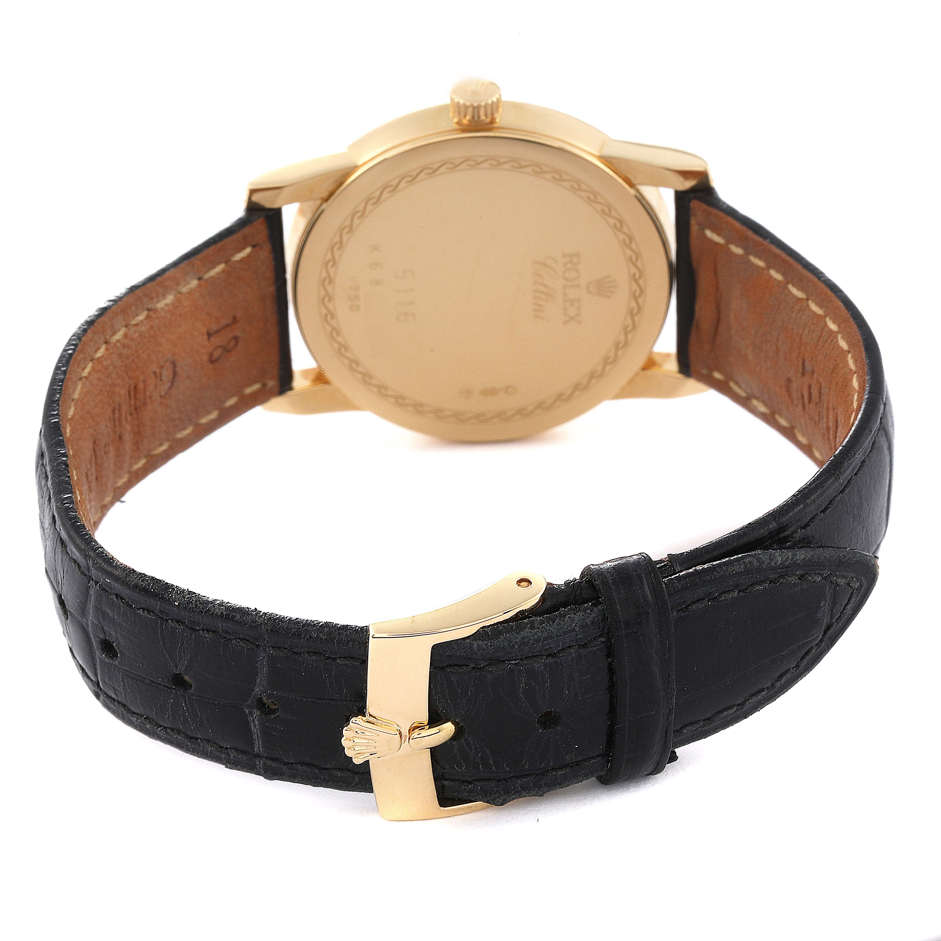 The image shows the back case and strap of a Rolex Cellini 5116/8 Men's Yellow Gold Beige Dial 5116/8 Men's Yellow Gold Beige Dial watch with a black leather band and gold clasp.