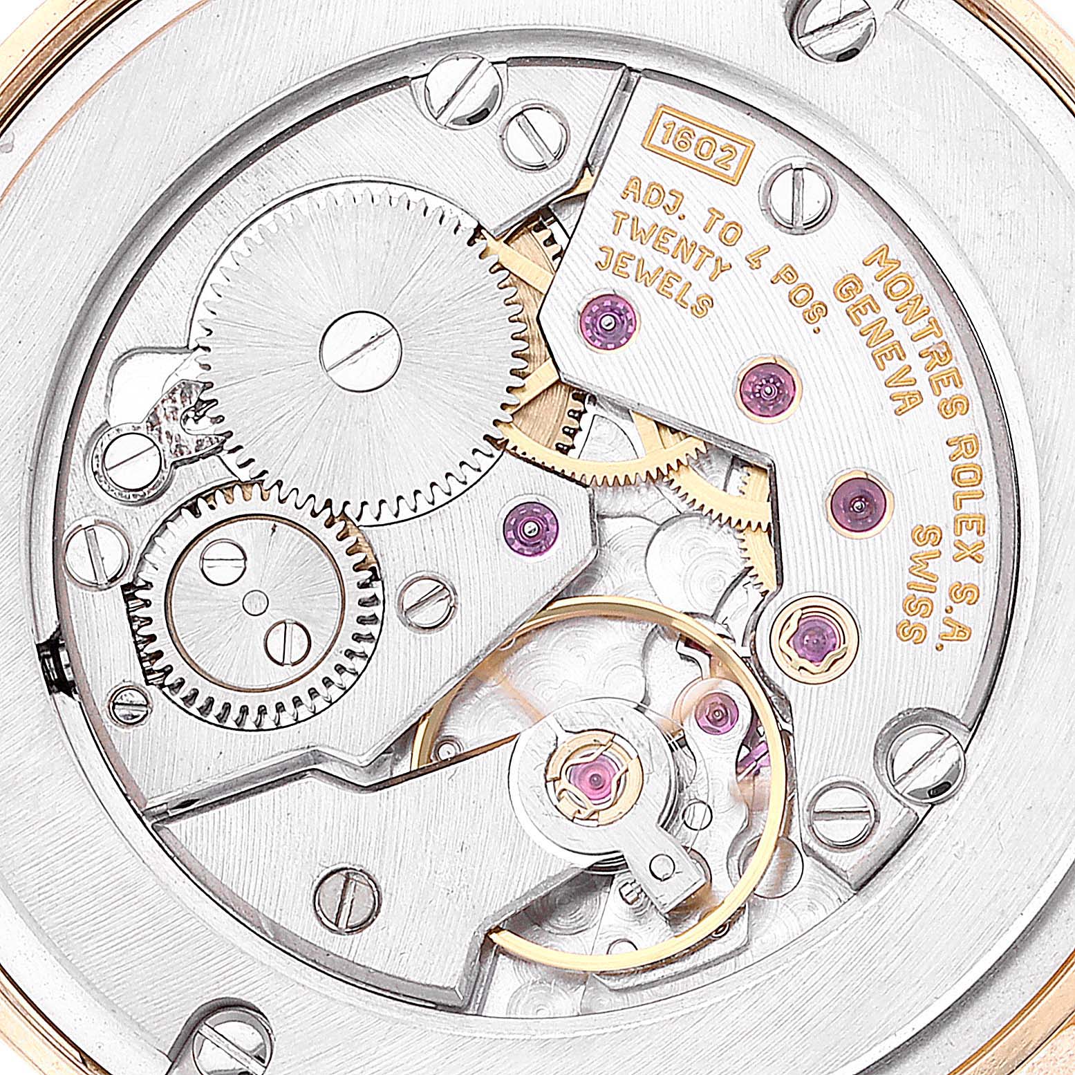 The image shows the intricate inner mechanism of a Rolex Cellini 5116/8 Men's Yellow Gold Beige Dial 5116/8 Men's Yellow Gold Beige Dial watch at a close-up angle, highlighting its gears and jewels.