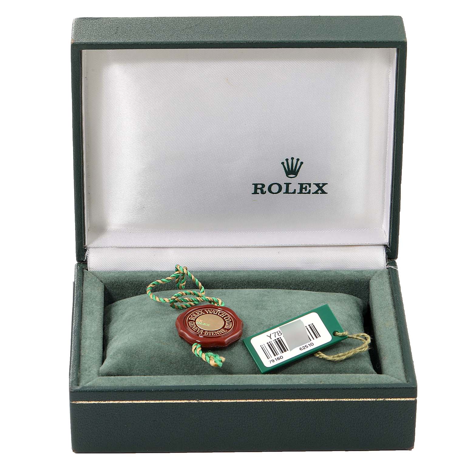 This image shows the open box for a Rolex Date 79160 Women's Stainless Steel Silver Dial 79160 Women's Stainless Steel Silver Dial model watch, displaying its tags and official seal.