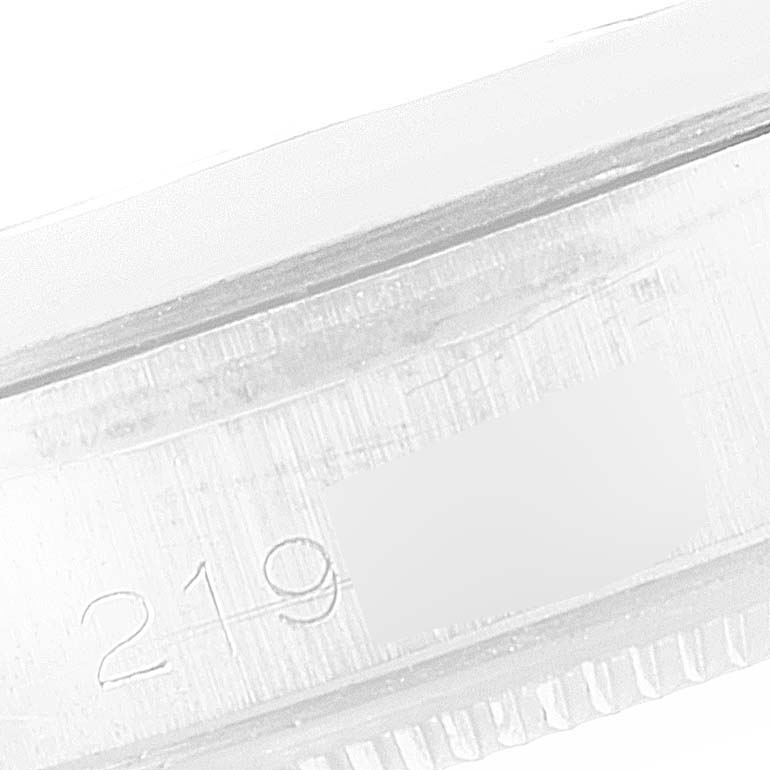 The image shows a close-up of the engraved serial number on the side of the Rolex Vintage Collection 1500 Men
s Stainless Steel Black Dial 1500 Men
s Stainless Steel Black Dial watch case.