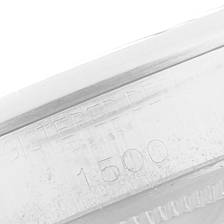 This close-up image shows the edge of the bezel with engraved details of the Rolex Vintage Collection 1500 Men
s Stainless Steel Black Dial 1500 Men
s Stainless Steel Black Dial model 1500.