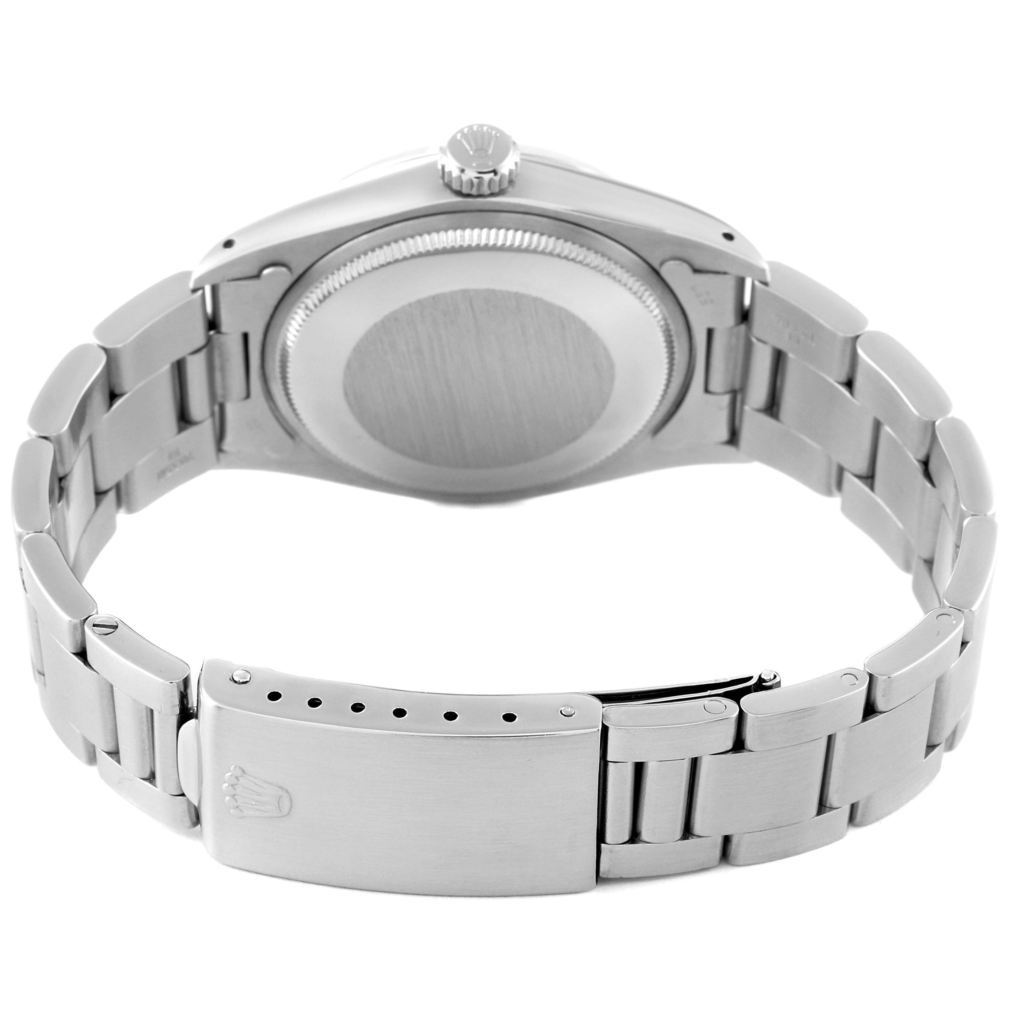 The Rolex Vintage Collection 1500 Men
s Stainless Steel Silver Dial 1500 Men
s Stainless Steel Silver Dial watch is shown from the backside, displaying the caseback, crown, and metal bracelet clasp.