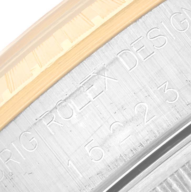 The image shows a close-up of the engraving on the Date model by Rolex, specifically the bezel and part of the case.