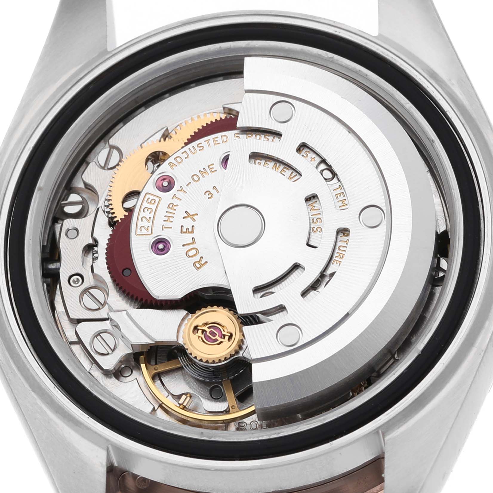 This image shows the Rolex Datejust 279171 Women's Steel and Gold (two tone) Mother of Pearl Dial watch movement from the back, highlighting gears and the rotor mechanism.