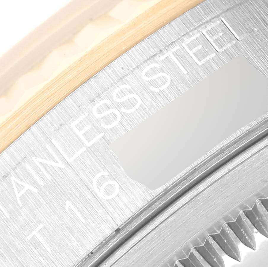 The image shows a close-up of the Rolex Datejust 16233 Men's Steel and Gold (two tone) Black Dial 16233 Men's Steel and Gold (two tone) Black Dial model, focusing on the stainless steel case and part of the fluted bezel.