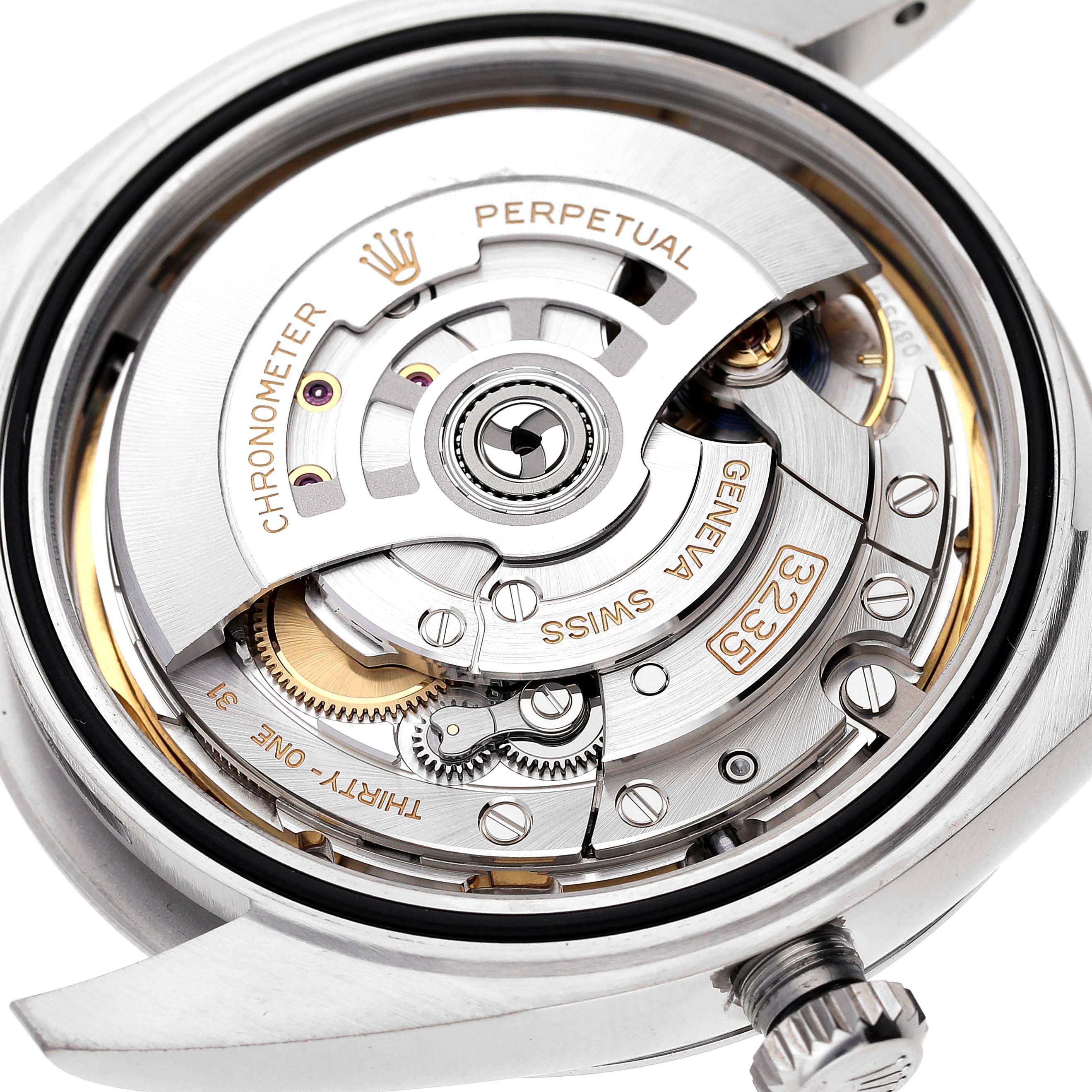 The image shows the movement and internal mechanisms of a Rolex Datejust 41 126300 Men
s Stainless Steel Blue Dial 126300 Men
s Stainless Steel Blue Dial watch, viewed from the back.